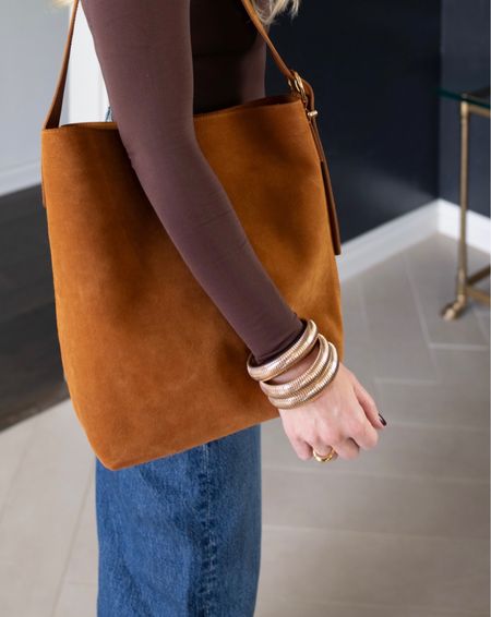 Bracelet 
Bucket bag 
Jeans 
Denim


#LTKfindsunder50 #LTKfindsunder100 #LTKitbag