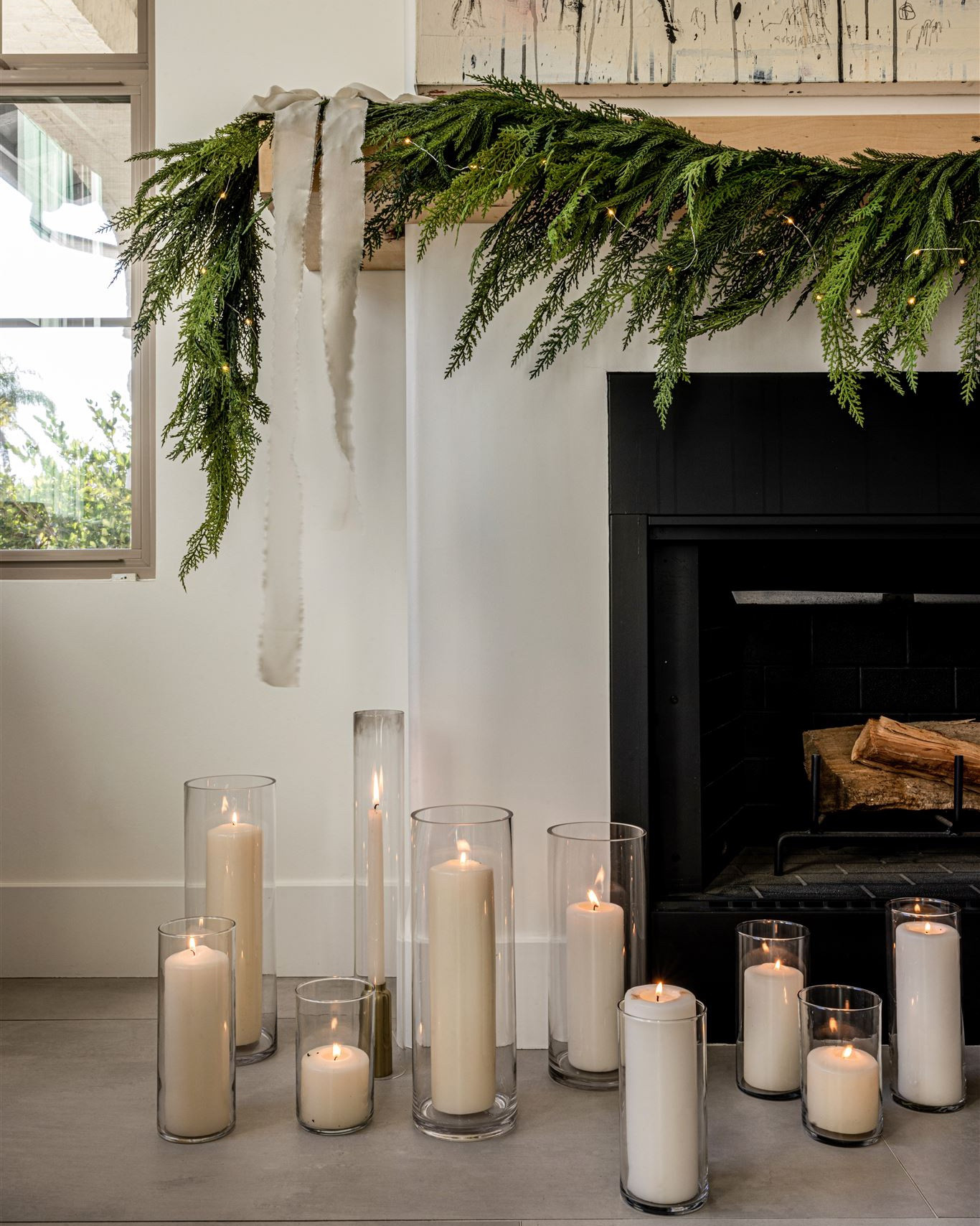Simple fireplace styling with my favorite garland, silk ribbon, twinkling lights and candles.

Mantel decor | holiday styling | holiday home | garland 

#LTKSeasonal #LTKHoliday #LTKhome