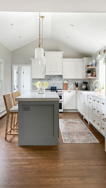 Coastal style kitchen with white cabinets, gold fixtures, and Serena and Lily barstools

#LTKfamily #LTKhome