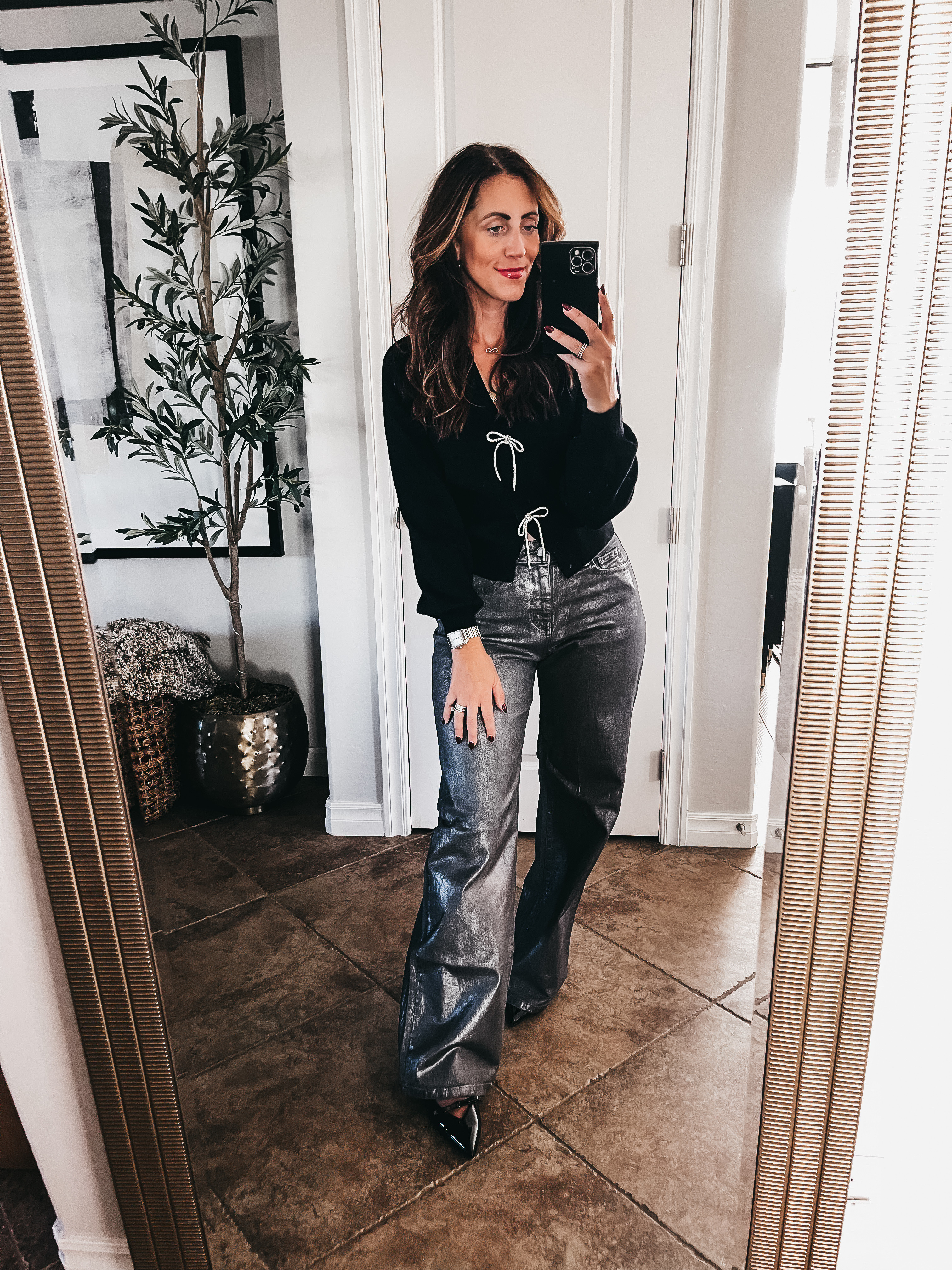 Holiday outfit idea! 🖤🪩// Crystal bow sweater cardigan with wide leg metallic jeans! 

- Sweater - size small 
- jeans - size 4 (run long, 31.5” inseam)
- patent leather bow kitten heels - size 8 (size up if in between)

Holiday style, holiday party outfit idea, holiday workwear, holiday sweater, festive sweater, bow sweater

#LTKHoliday #LTKFindsUnder50 #LTKStyleTip