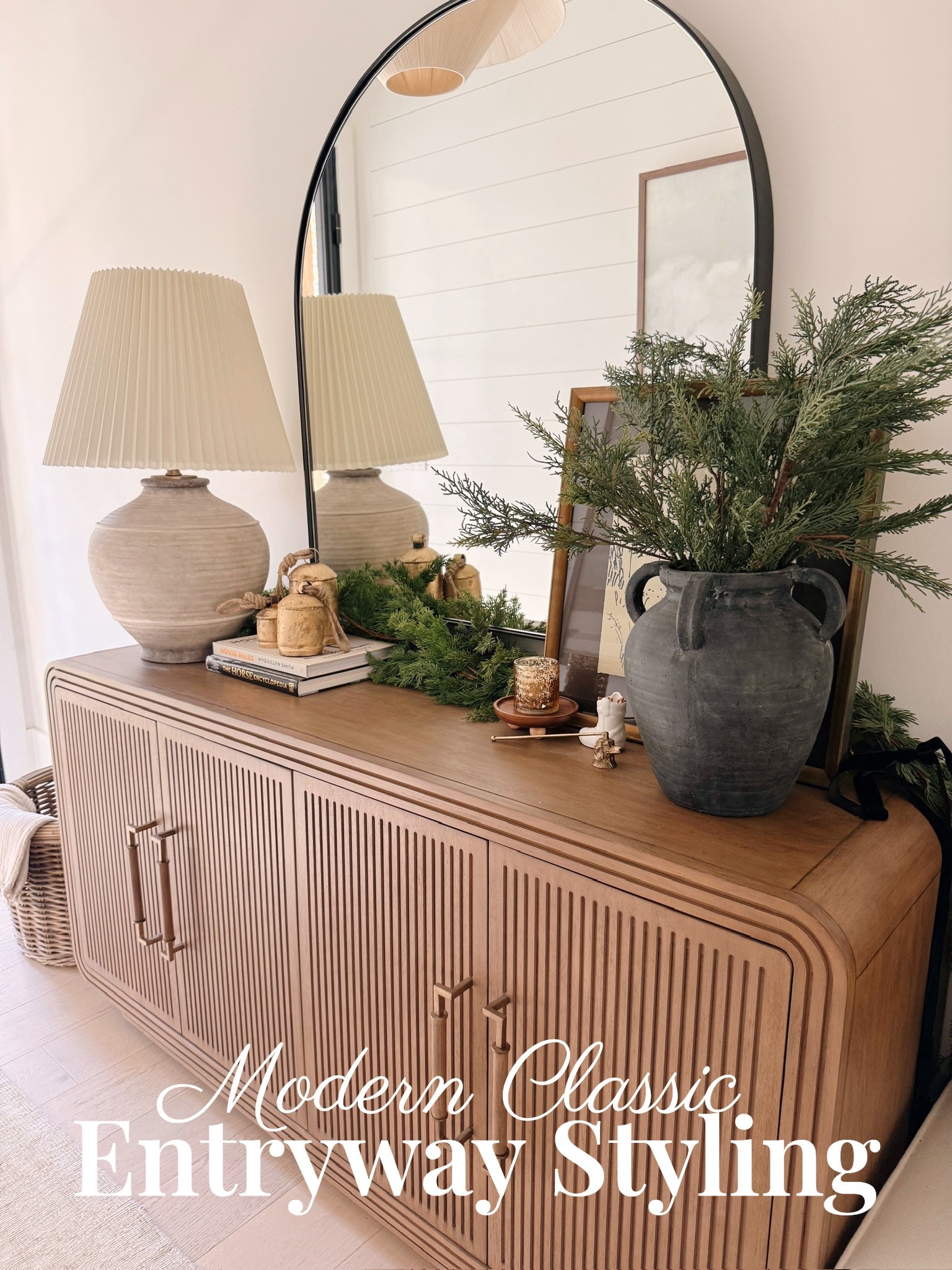 🌿 If you want your home to feel polished and designer-curated from the very first step inside… start with the entryway.
The ribbed console adds texture and warmth, the pleated lamp brings soft ambient lighting, and the arched mirror opens up the space beautifully. Layered artwork and greenery add personality while keeping everything calm and cohesive.

#porcheandco #entrywaydesign #modernclassicinteriors #consoletabledecor #archedmirrordecor #neutralhomestyle #sculpturallamp #organicdecorstyle #entrywayinspiration #minimalhomevibes

Do you want to bring our dreamy Modern Classic style interior design into your own home? 🏡 You’re in luck! Reserve our Online Interior Design packages today -> https://porcheandco.com/edesign ✨ We can’t wait to work with you & design your home with #porcheandco


#LTKSeasonal #LTKHoliday #LTKHome