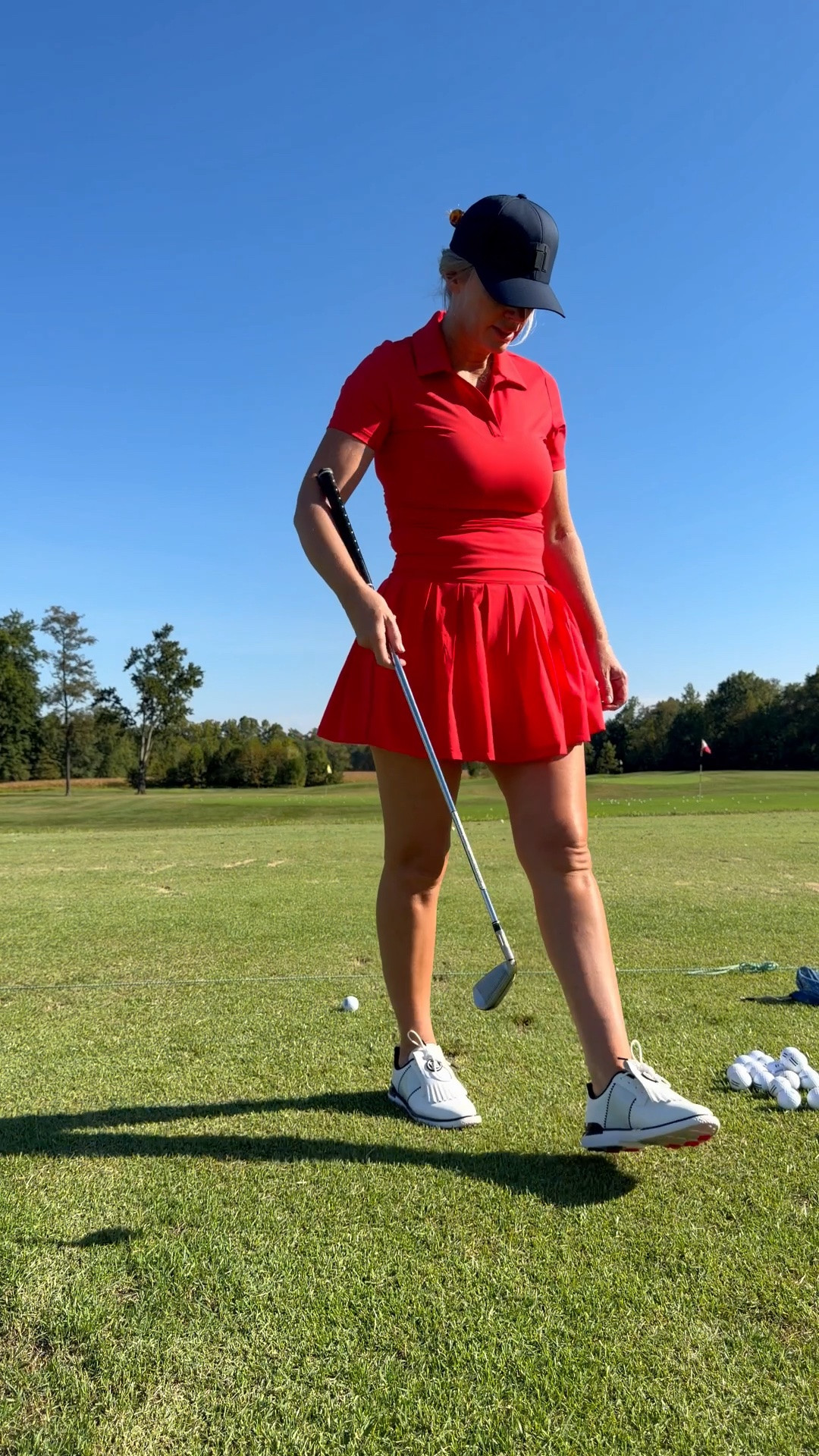 Travis Mathew golf outfit. It runs true to size, I’m wearing a medium. The color is called tomato. 

Travis Mathew, golf outfit, women’s golf outfit inspo, red golf skirt, red golf polo

#LTKOver40 #LTKTall #LTKActive