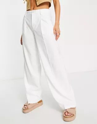 Bershka slouchy low waist tailored pants in white | ASOS (Global)