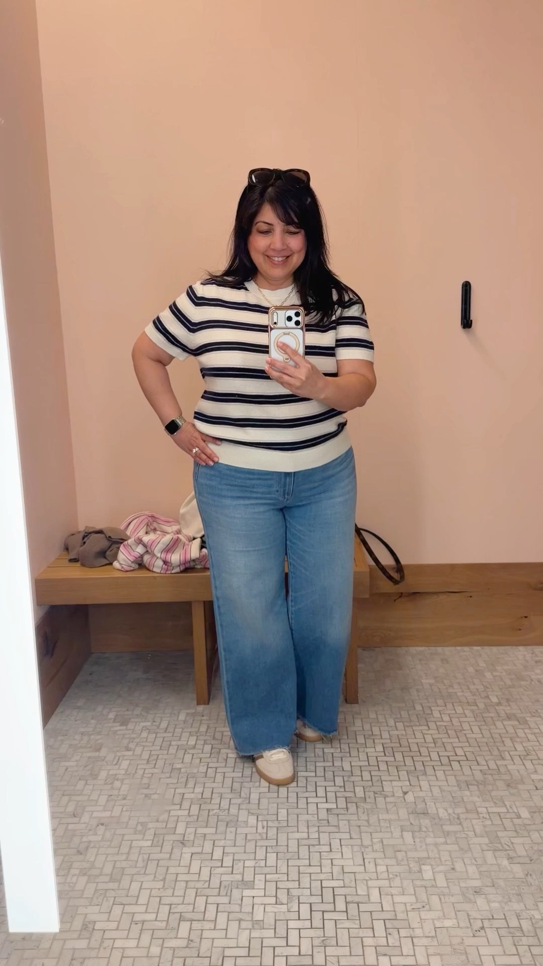 Love this striped cashmere tee for transitioning from winter to spring! Great neutral palette that can be paired with jeans, pants, shorts and skirts. I paired it here with wide leg jeans but this tee would also be perfect with the viral Aritzia lodge pants that can be dressed up or dressed down and make the perfect workwear or travel outfit! 

Aritzia cashmere tee size XL. Paige Anessa wide leg jeans size 32 petite. Adidas handball Spezial sneakers run big. I usually wear a 7.5 or 8 in shoes and I wear these in a size 7.

#LTKMidsize #LTKPetite #LTKOver40