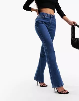 ASOS DESIGN Hourglass flared jeans in mid blue | ASOS (Global)