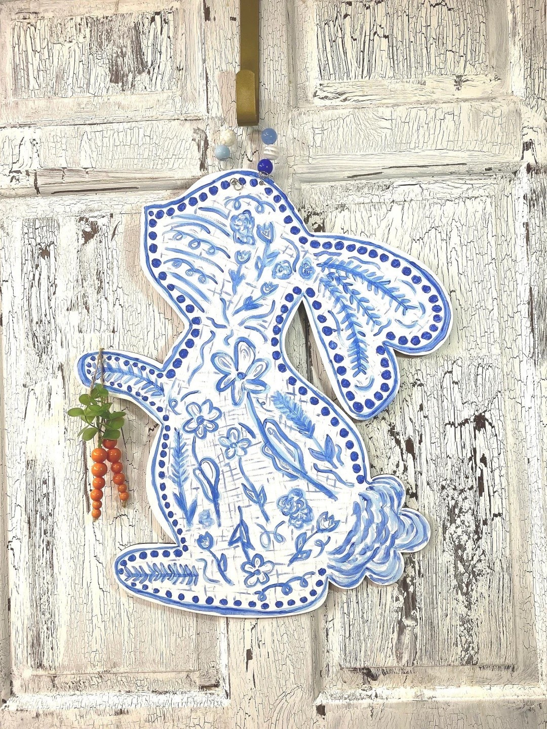Add timeless spring charm to your front door with this beautifully hand-painted wooden bunny door hanger inspired by classic blue Chinoiserie design. Crafted from quality birch plywood and painted by hand, each piece is uniquely made, bringing a soft, elegant touch to your Easter and spring décor. Perfect for entryways, covered porches, or interior styling, this whimsical bunny creates a welcoming statement you can enjoy all season long.

#LTKHome #EasterDecor #SpringDecor #FrontDoorDecor #FarmhouseDecor #Chinoiserie #BlueAndWhiteDecor #DoorHanger #SeasonalDecor #EntrywayDecor #HandmadeDecor #HomeInspiration #SpringHome #LTKFinds #BunnyDecor 

#LTKdayinmylife #LTKHome #LTKSeasonal