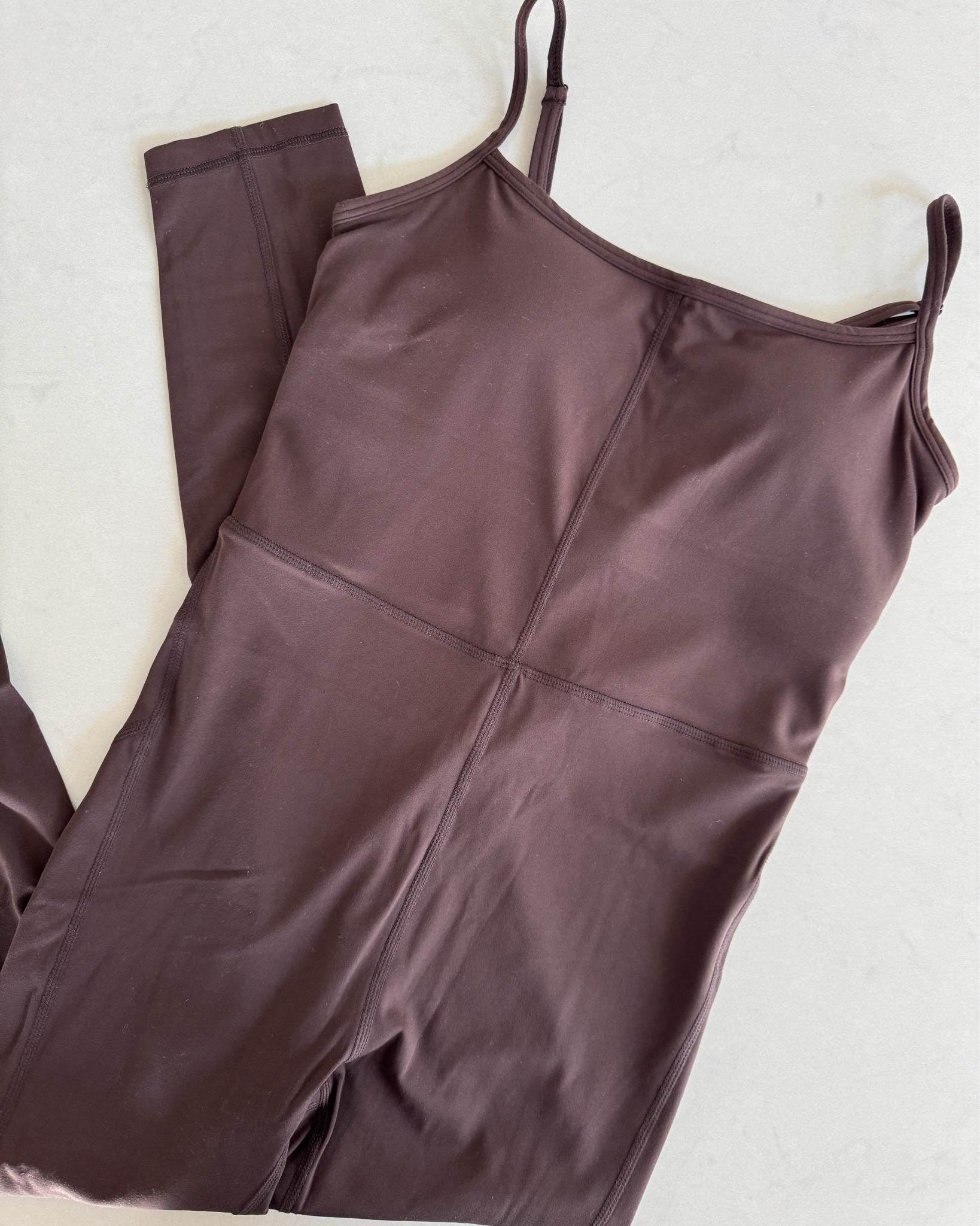 My espresso brown jumpsuit from Quince has been a repeat outfit for the last year. The ultra form fabric is so buttery soft & the fit is everything. Spaghetti straps, built-in support, & full length legs make this the perfect one-&-done workout look. Linked in my LTK! @Quince 

activewear - athleisure - workout jumpsuit - one piece - unitard - full length jumpsuit - ultra form - Quince - Quince activewear - brown jumpsuit - espresso brown - chocolate brown - spaghetti strap - built-in bra - gym outfit - yoga jumpsuit - pilates outfit - studio to street - workout outfit - form fitting - sculpting - buttery soft - affordable activewear - under $100 activewear - everyday activewear - loungewear jumpsuit - monochromatic outfit

#LTKU #LTKActive #LTKfitnessgoals