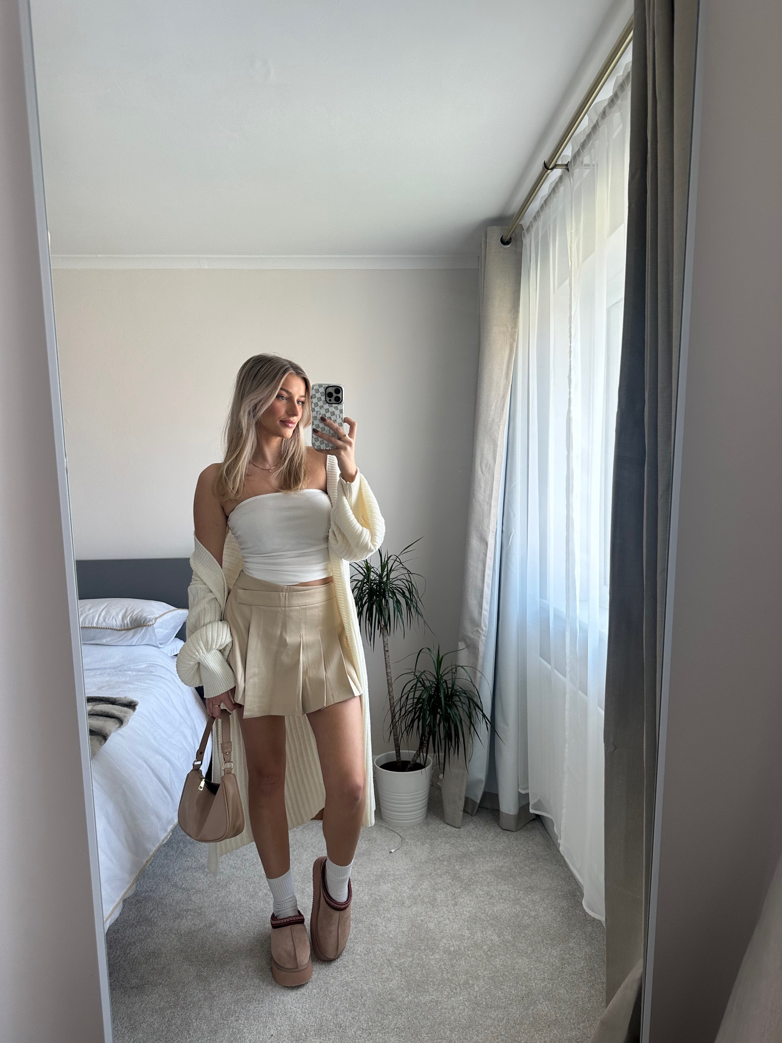 White tube top, cream longlined knitted cardigan, cream
Pleated skirt, platform ugg dupes, plt, quiz, autumn 

#LTKSeasonal #LTKstyletip #LTKeurope