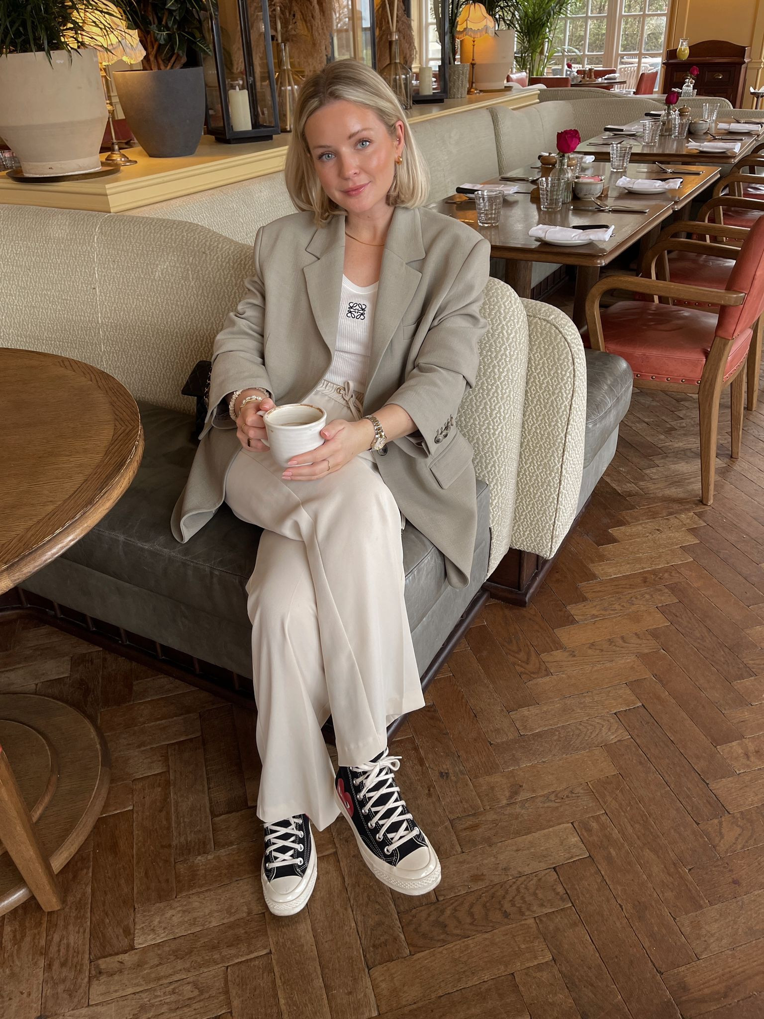 Neutral spring outfit perfect for coffee dates. H&M sage green oversized blazer, Loewe anagram white vest top, cream elasticated waist tailored trousers, black converse shoes  

#LTKeurope #LTKshoecrush #LTKstyletip