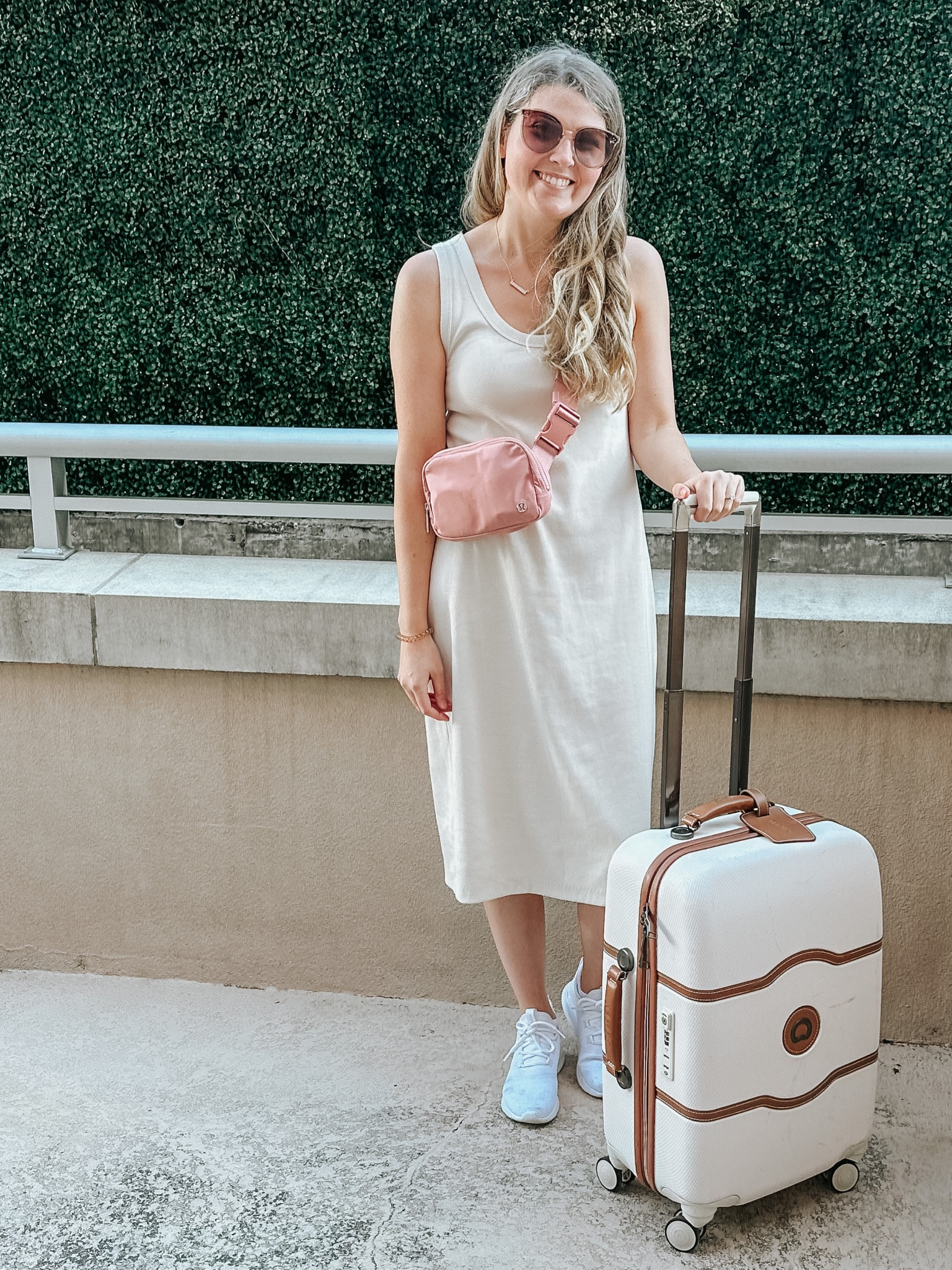 This dress is a PERFECT closet staple and only $20! Comes in multiple colors and is super comfortable and flattering. I am wearing a large and I would say it fits tts.
If you do not have a crossbody bag and you travel this is your sign to get one. I wore mine my entire flight and was super comfortable and had everything I needed right there so I didn’t have to keep bending down to get things out of my larger bag. 
I am wearing a size 7 in my sneakers and they run big so you can potentially size down a half size. They’re perfect for travel and match everything .

#LTKSeasonal #LTKunder50 #LTKtravel