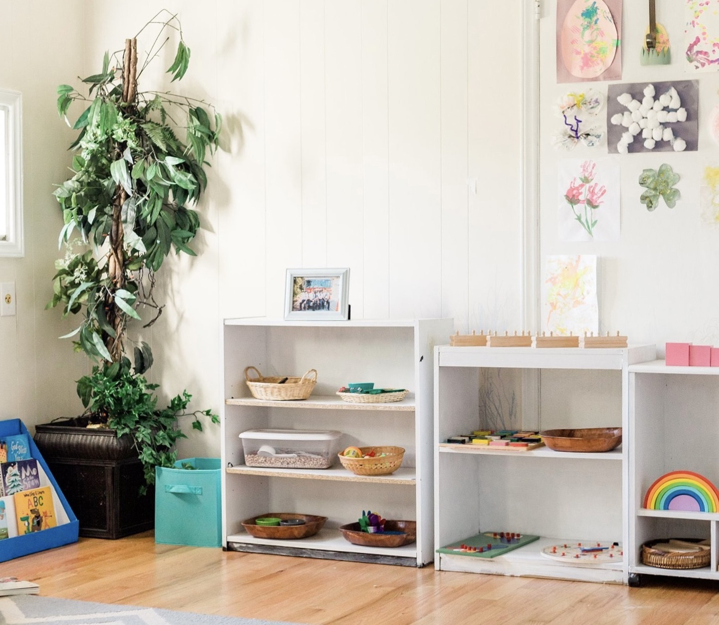 Montessori setup for young toddlers: low shelves where everything is easily visible and accessible, minimal and clutter-free learning environment, wooden educational toys, baskets and bins to keep everything separated. #homeschool #montessori

#LTKkids #LTKbaby #LTKhome
