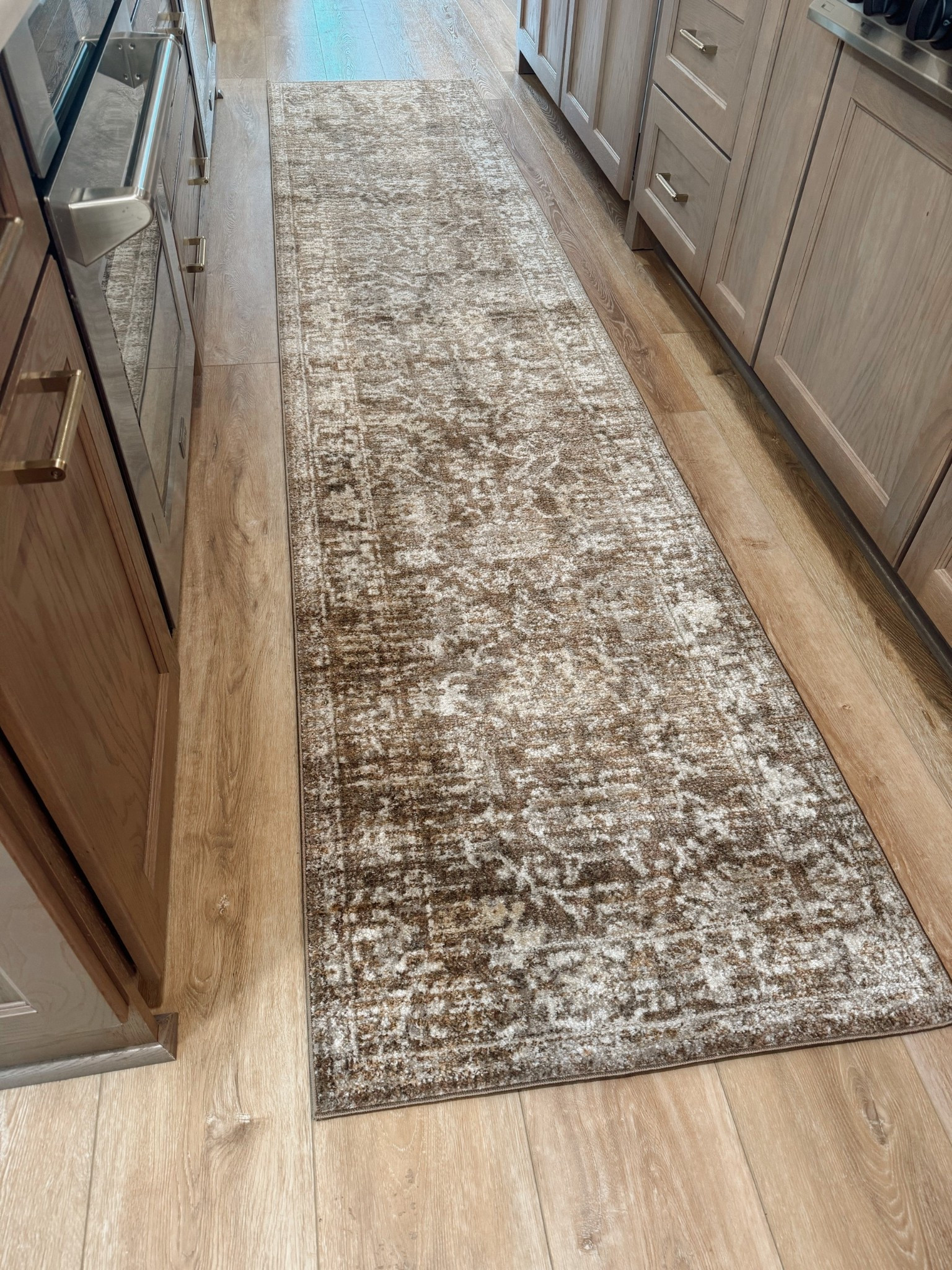 Our new kitchen runner FINALLY🤎😍 I absolutely love it. I was a little worried of it being so dark but it’s such a high traffic area, it’s necessary lol. So gorgeous! This is the 2’-6” x 12’-0” size! 

Home decor / cozy home / neutrals / lolol magnolia / Joanna Gaines / Amazon home / Holley Gabrielle / Wayfair / rugs USA 

#LTKStyleTip #LTKHome #LTKFamily