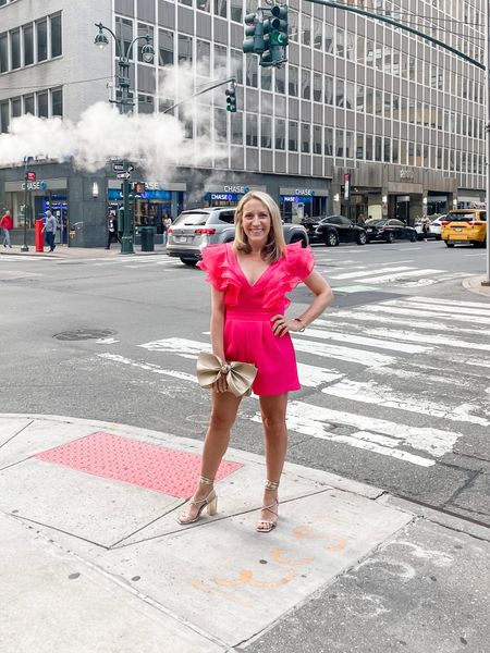 Pink romper with ruffle sleeves. Cocktail dress. Party outfit. True to size. Bow clutch and strappy open toe lace up sandals. 

#LTKSeasonal #LTKFind #LTKunder50