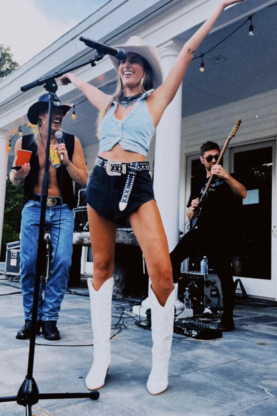 Summer House star Amanda Batula denim crop halter vest, black denim cutoffs, white cowboy boots, white cowboy hat

#LTKFind #LTKsalealert #LTKFestival