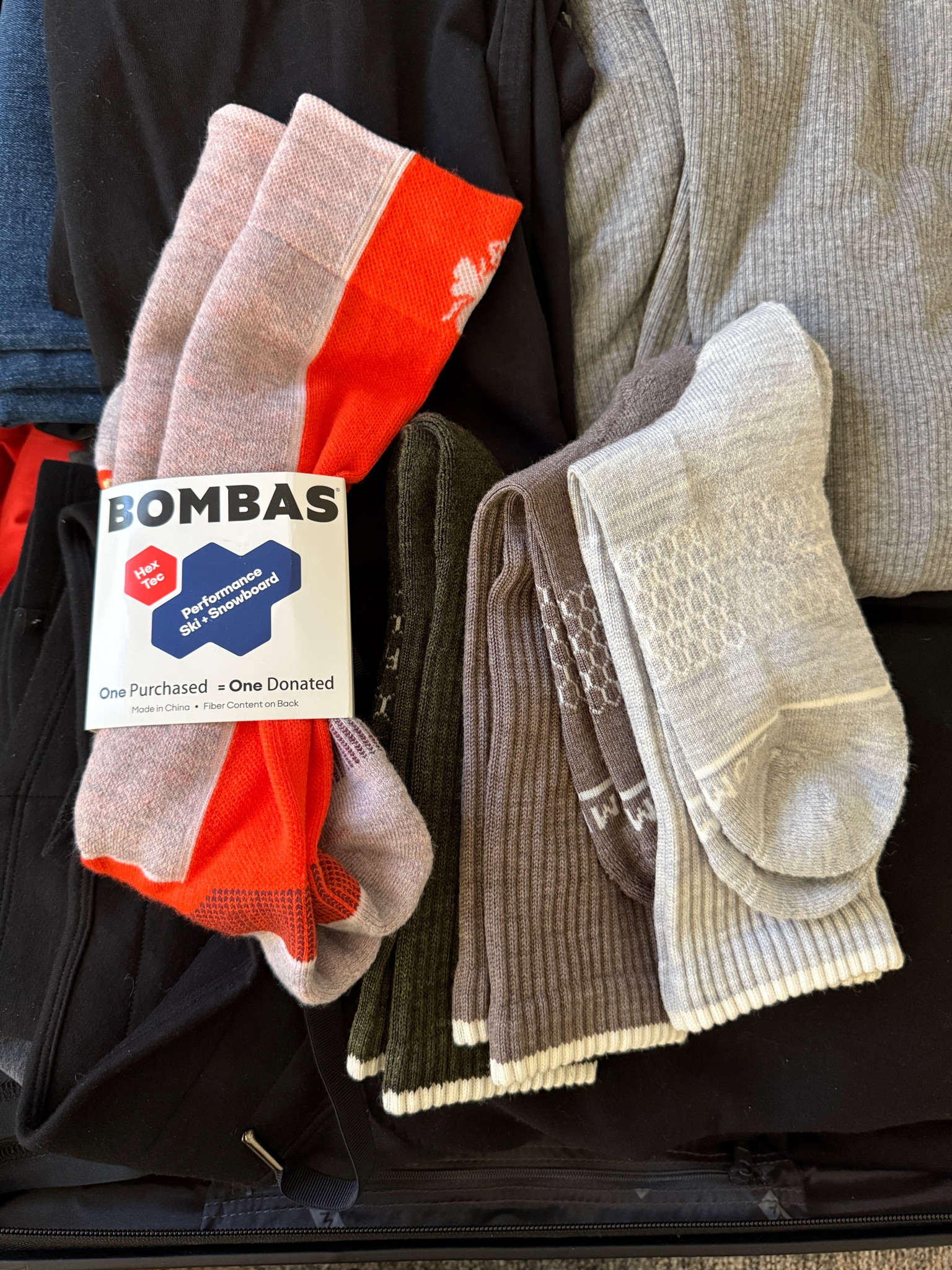 Packing @bombas socks for our ski trip this past week! The Merino Wool Blend socks keep my feet warm and dry and the purple and orange ski socks are both comfortable and stylish, matching what I’m packing perfectly. #BombasPartner #bombas
