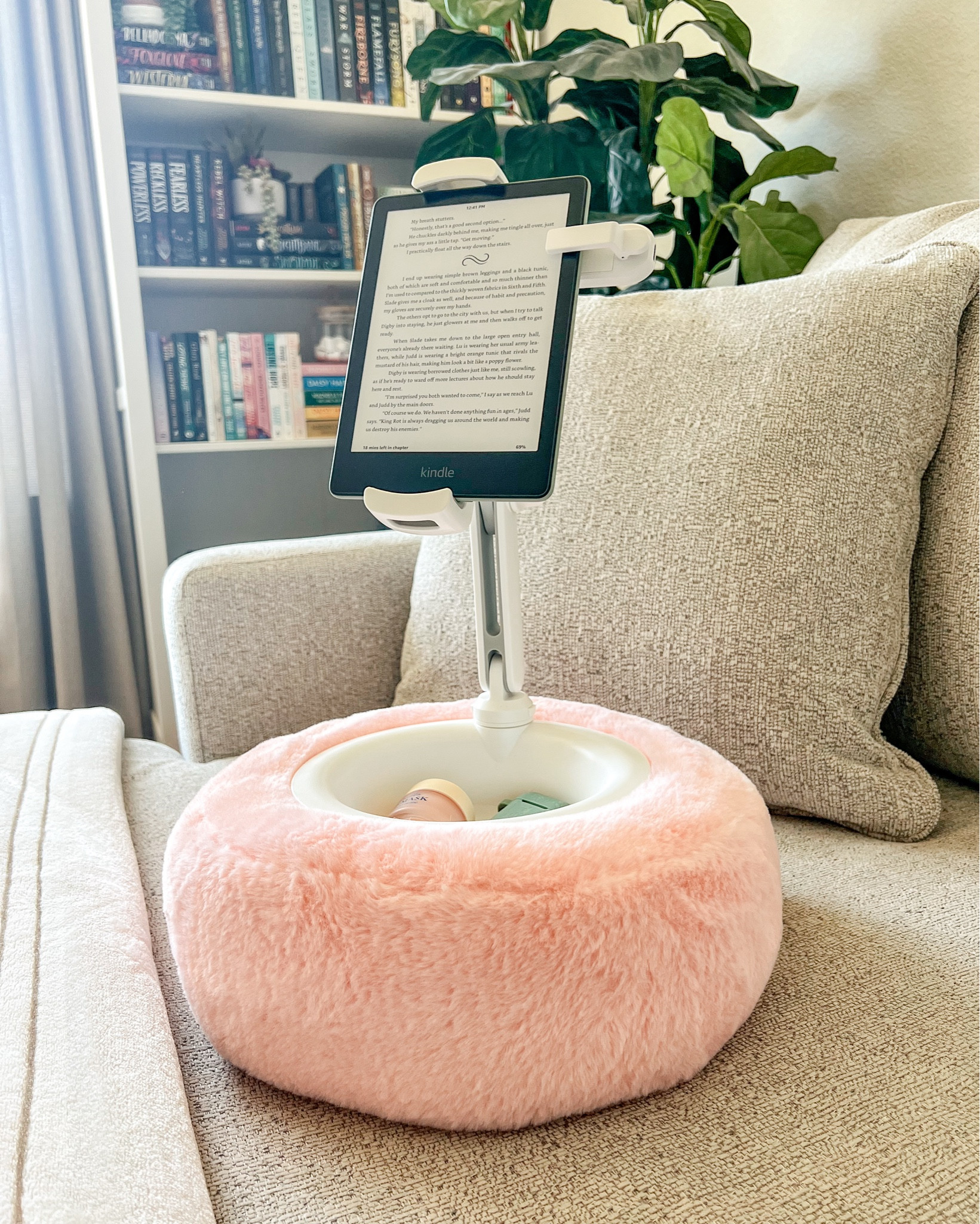I got this for my birthday and now I’m wondering how I ever read without it?! It’s amazinggg!! 

I keep my necessities in the center (lip mask, air pods, extra hair ties, page turner, mints, etc.) but you can also fit your phone or even fill it with snacks!

The stand is so strong and it’s super easy to pop my kindle (or phone) on and off. And the fuzzy base is soooo soft! I got it in pink, but it comes in other colors too!

If you love to read on your kindle while snuggled up on the couch, then this is a must!! I love it so much!! 

#bookish #fortheloveofbooks #booktok #bookstagram #bookfinds #bookishgifts

#LTKSaleAlert #LTKGiftGuide #LTKHome