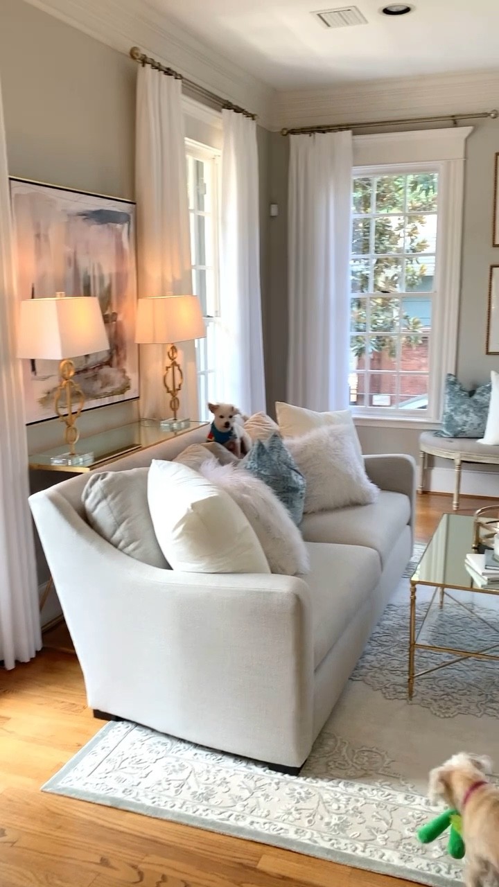 Living and dining room home tour large chandelier round dining table mirror top glass gold coffee table French chairs affordable rugs large antique gold mirrors tufted bench botanical prints gold leaf lamps 

Send me a DM on Instagram for the link to the abstract art 

#LTKstyletip #LTKunder100 #LTKhome