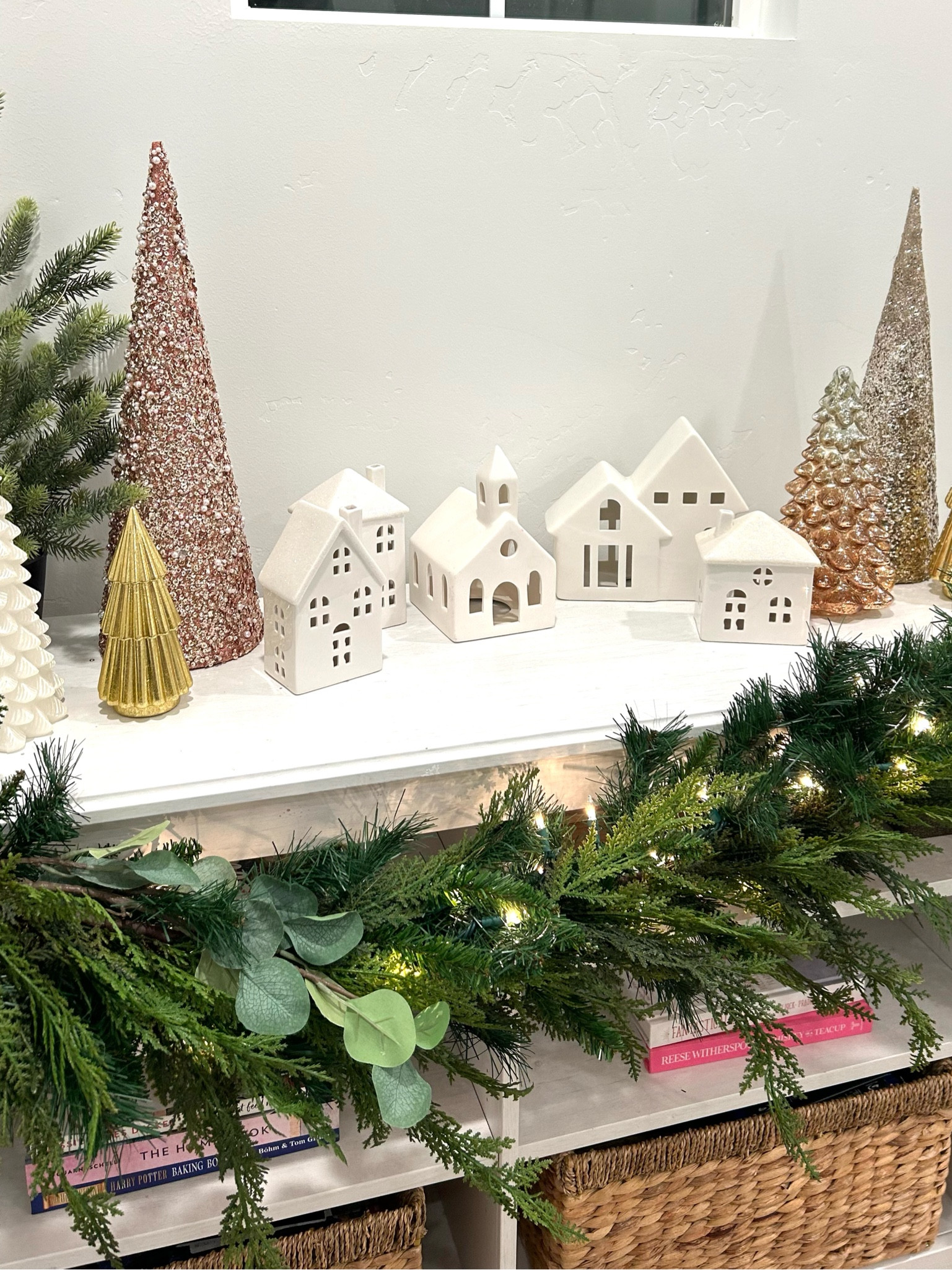 Cute Christmas Village! I have collected little houses from several stores, along with the variety of trees and each year my village grows by one and looks a little different. 

#LTKFindsUnder50 #LTKSeasonal #LTKHoliday