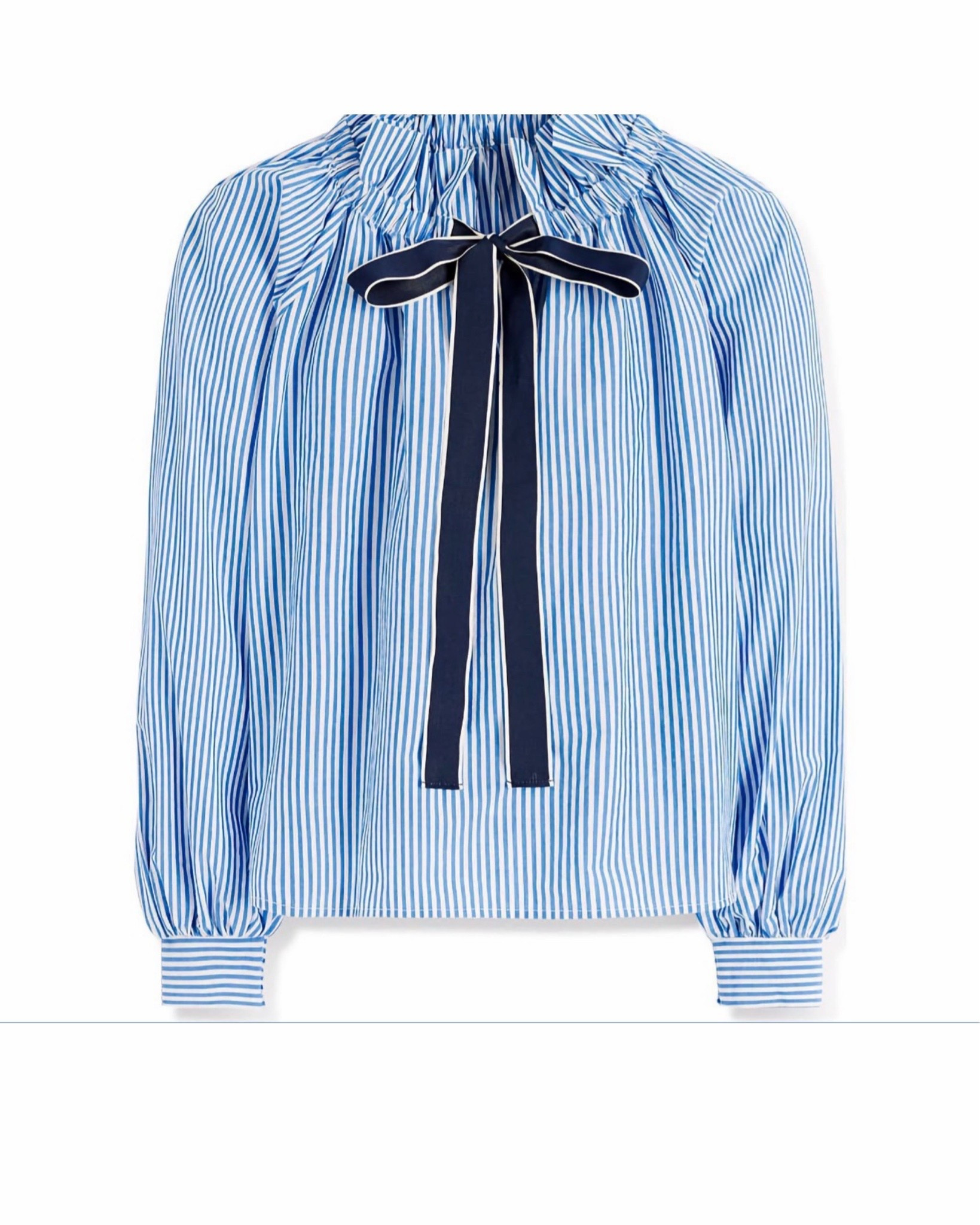 Elevate your wardrobe with one of our favorite bow neck ruffle shirt. Pair it with a dark pair of denim jeans, a bow ballet flat and an eye catching bucket bag. s