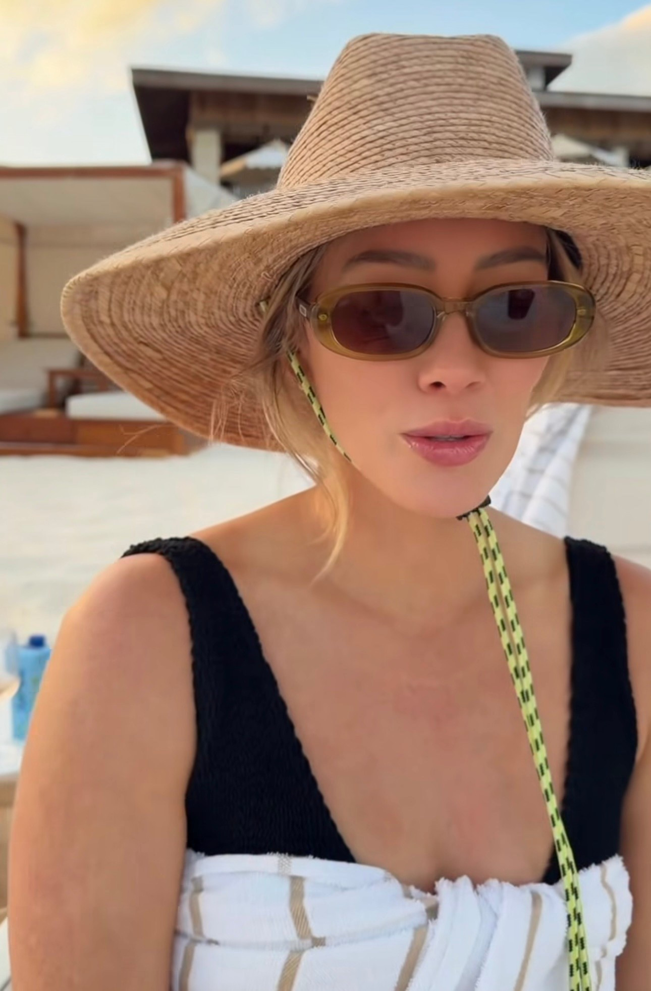 Shop Hilary Duff's round sunglasses black one piece swimsuit  ￼