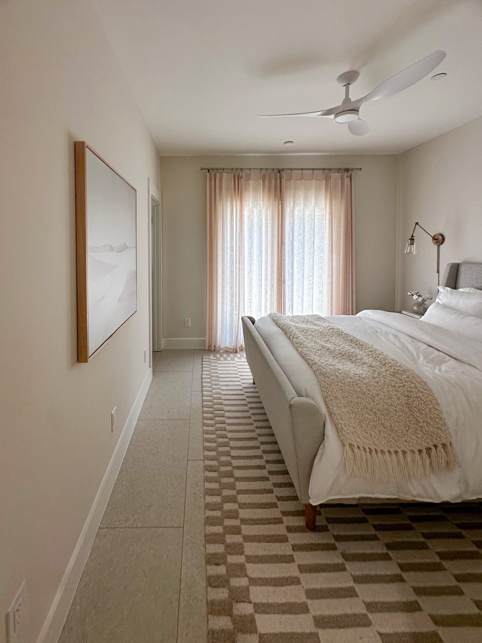 Welcoming guests with cozy neutrals 🤍 This serene guest room features layered textures, soft lighting, and a modern ceiling fan for a restful stay. Shop my bedding, rug, and decor picks here to recreate the look! #GuestRoomGoals #NeutralHomeDecor #LTKHome

#LTKHome