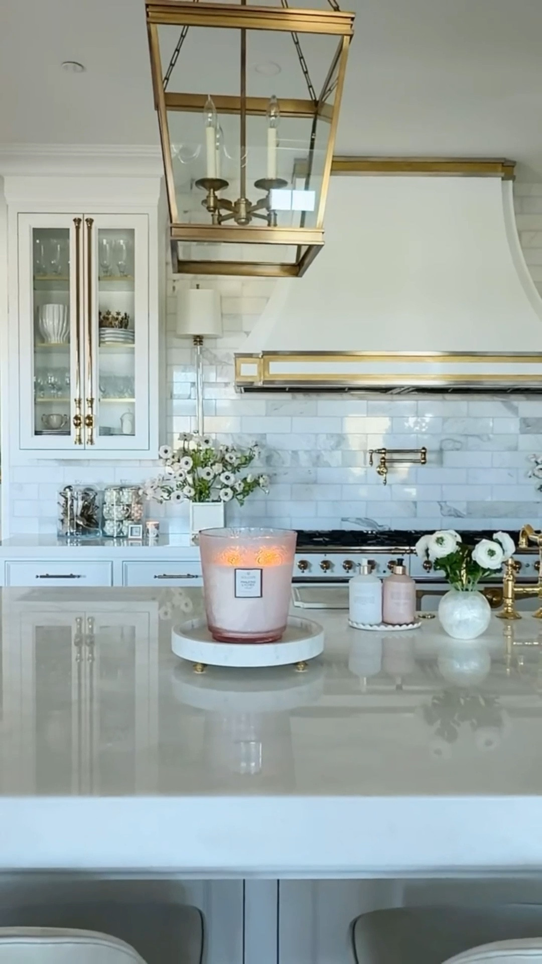 Sitting on the other end of the island is a giant five-wick Panjore Lychee Candle — it smells absolutely incredible and makes such a statement on a beautiful marble tray (currently on backorder, but here is a lovely alternative).

#LTKHome #LTKSeasonal