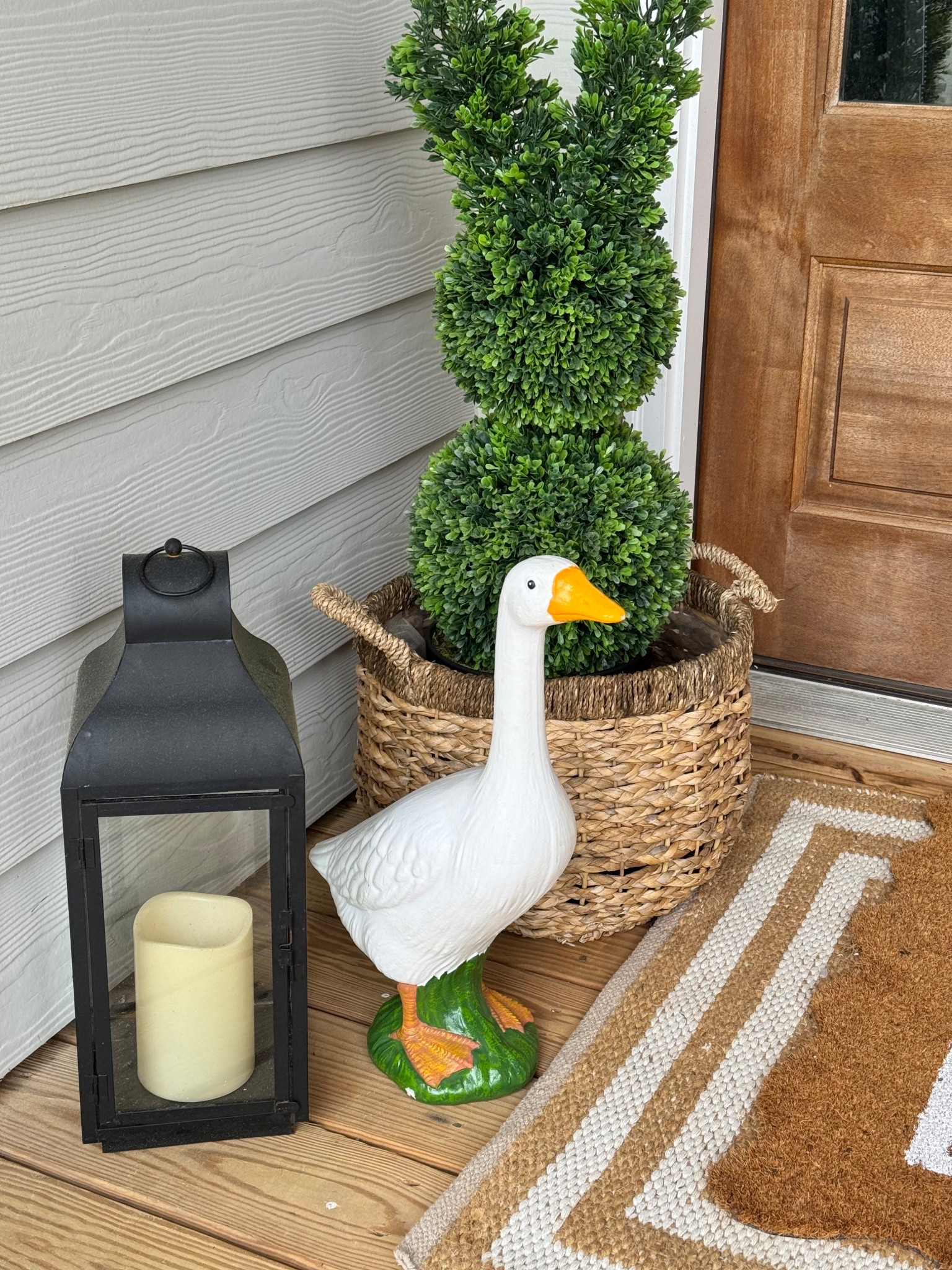 Porch goose back in stock! Bunny topiary also back in stock!! Excuse the pollen, here in the south we are covered already!! Easter decor, front porch decor 