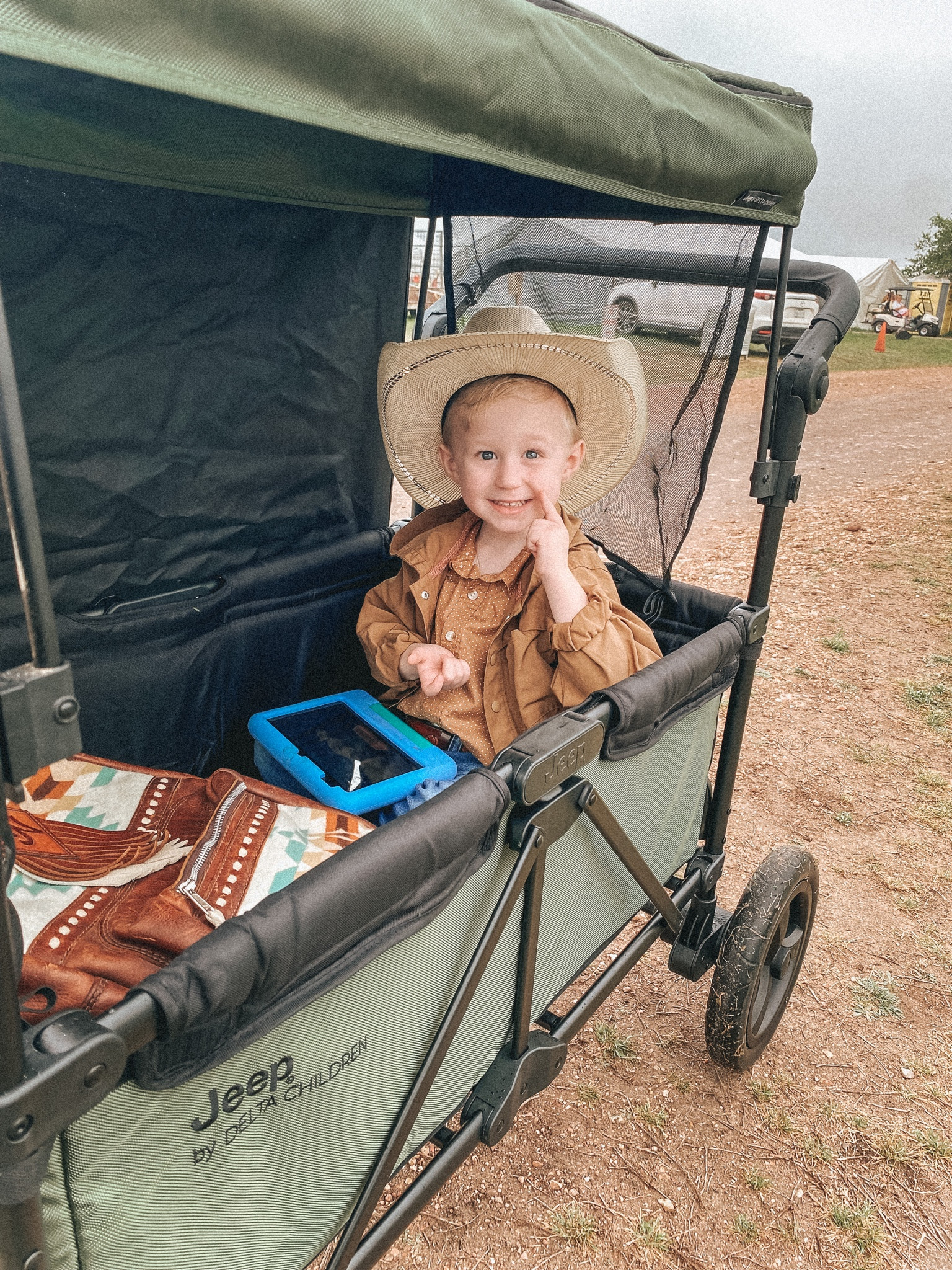 Riding in style😎 Hitting the antique festival in his new Jeep wagon stroller. Has a canopy that’s great for the rainy day ☔️ 
Wagon stroller, Toddler gear, Kids wagon, Festival necessities, Baby shower gift, Cowboy hat, Western style, Family activities 

#LTKfamily #LTKkids #LTKFestival