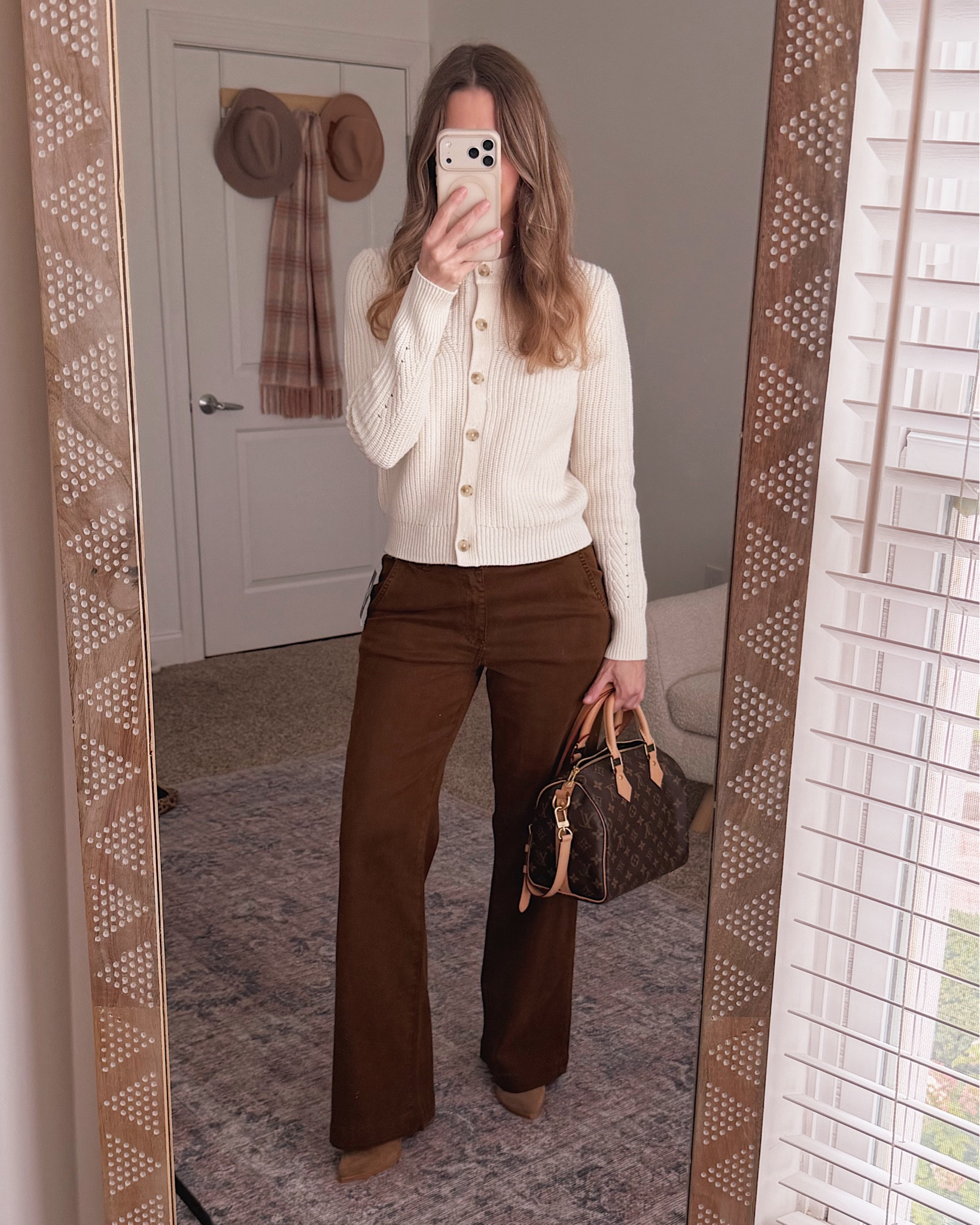 This cream button cardigan from the Nordstrom Anniversary NSale pairs so perfectly with brown wide leg trousers for a fall outfit that looks way more expensive than it is.

#LTKSeasonal #LTKOver40 #LTKSaleAlert