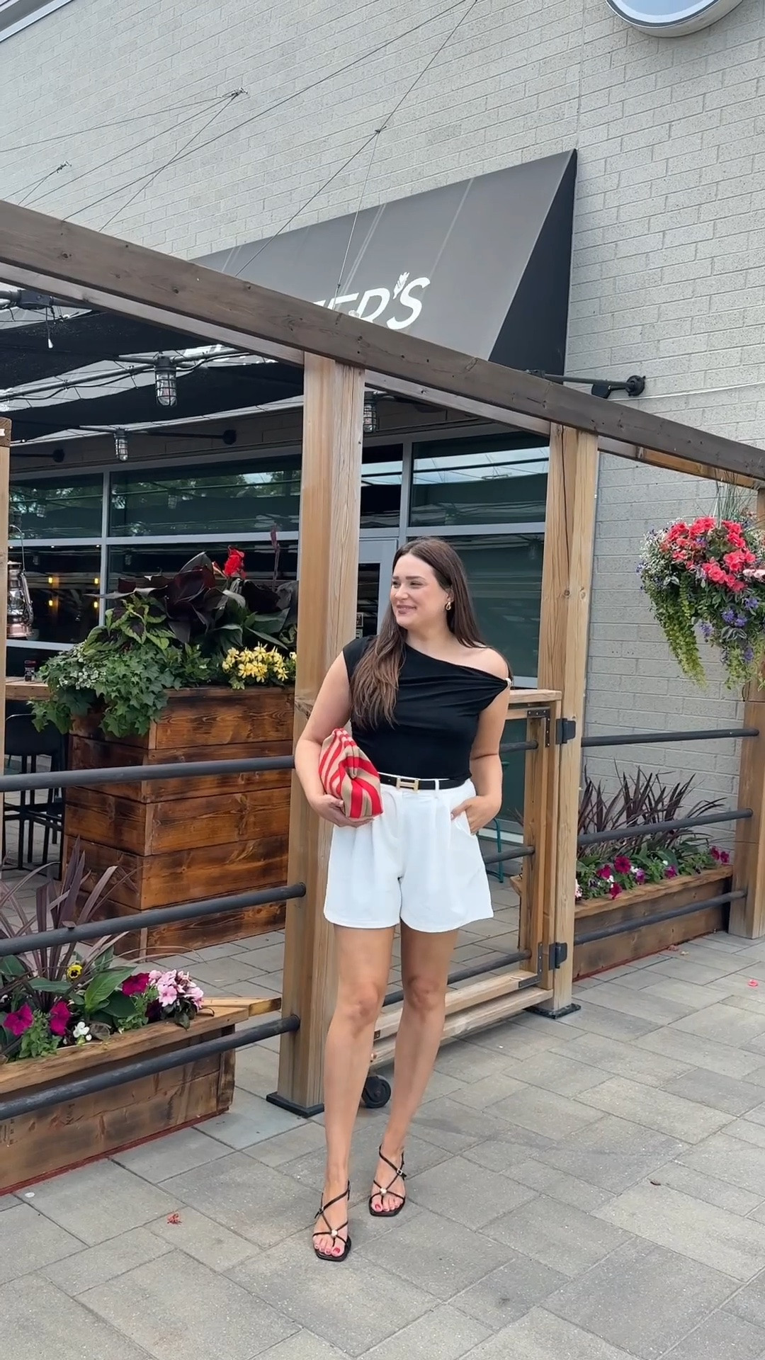 Easy everyday elevated outfit. Off the shoulder top, white shorts, black heels, h belt and red striped bag.

#LTKMidsize #LTKTall #LTKootd