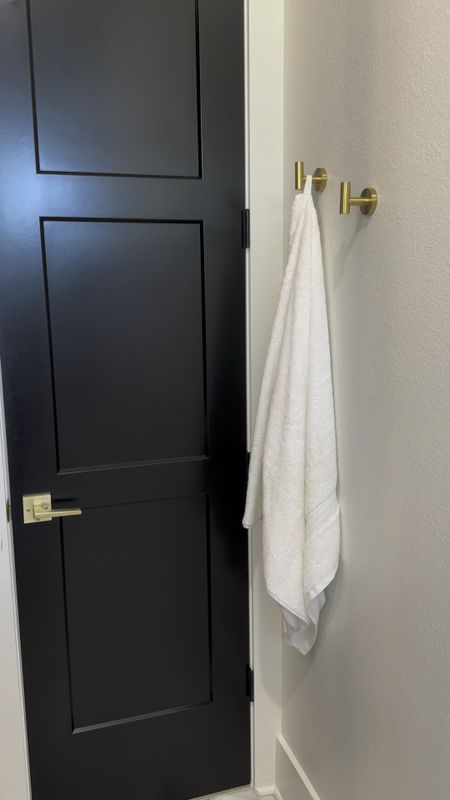 Gold bathroom hooks and bath towels with loops to hang them with. 

Prime day deals. Amazon prime day. 

#LTKsalealert #LTKxPrimeDay #LTKhome