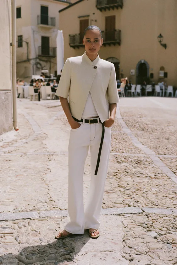 Blazer made from a linen blend. Featuring a high neck, short sleeves with shoulder pads, front we... | Zara UK