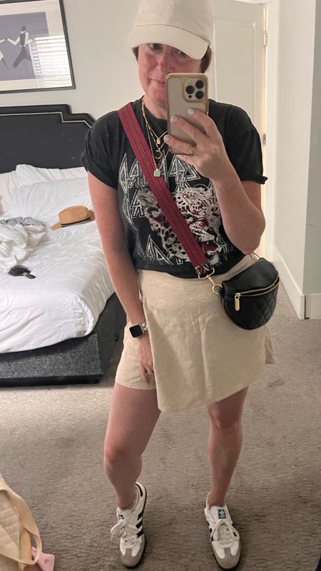Day one of our summer vacation to chicago. Love this skort and its linen. Fun band tshirt. Crossbody bag and removable strap. Sneakers are a must for any city trip. Easy on the go travel outfit. Can dress up or down this skirt  

#LTKActive #LTKOver40 #LTKTravel