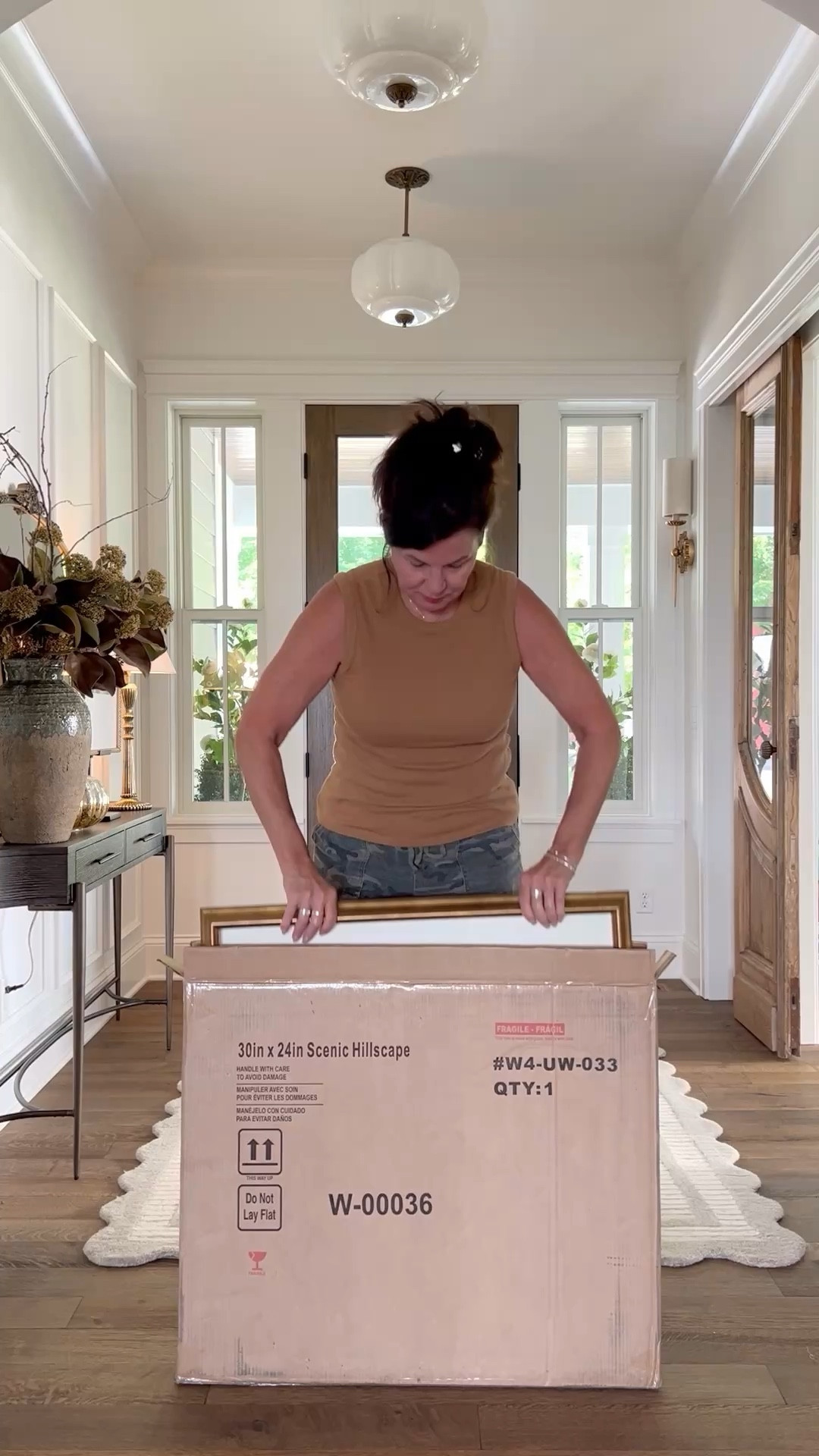 How high should I hang my art? 
At eye level. Your eyes should fall at the middle of the artwork. 

A good average for hanging art and photos is that the middle should be 57-60 inches from the floor. If you’re tall or have 10’ plus ceilings go a few inches higher. When hanging a larger collection of pictures, treat them as one large piece, centering the grouping at that same 57-60 inch measurement. My preference is 2-3 inches between art, when hanging multiples. Eye level is so easy to remember. If you’re very petite, use inches. I’ve link some of the art I have in my home as well as other favorites. 