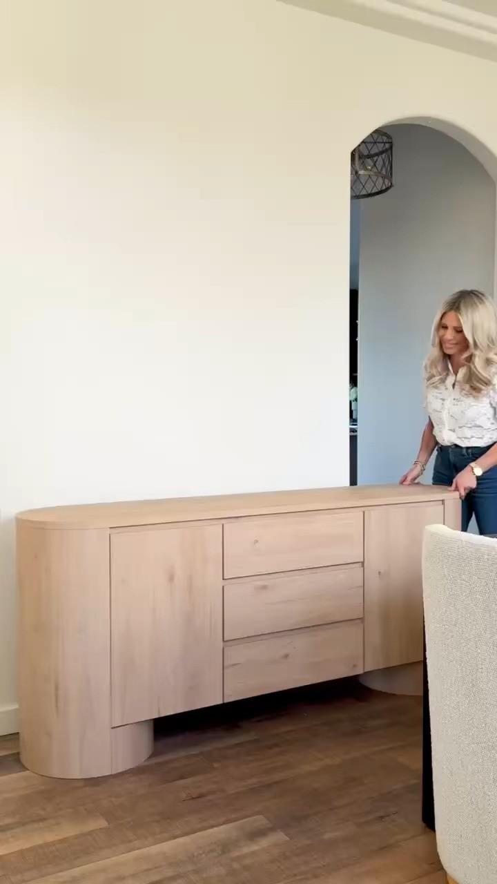TRENDING NOW — FLUTED WOOD SIDEBOARD — MODERN ORGANIC LOOK FOR LESS! This FLUTED WOOD SIDEBOARD is the definition of MODERN ORGANIC design. The curved base detail and clean drawer lines give it that high-end custom feel without the designer price tag. I love how it anchors a space while still keeping everything light and neutral. Style it in a dining room, entryway, or even as a statement office piece — it instantly elevates the entire room.

#Amazon #TheHillaryStyle #FlutedFurniture #ModernOrganicDecor #DesignerLookForLess #NeutralHome #DiningRoomInspo #EntrywayStyle #AffordableLuxury #HomeStyling 

 #LTKU #LTKOver40 #LTKHome