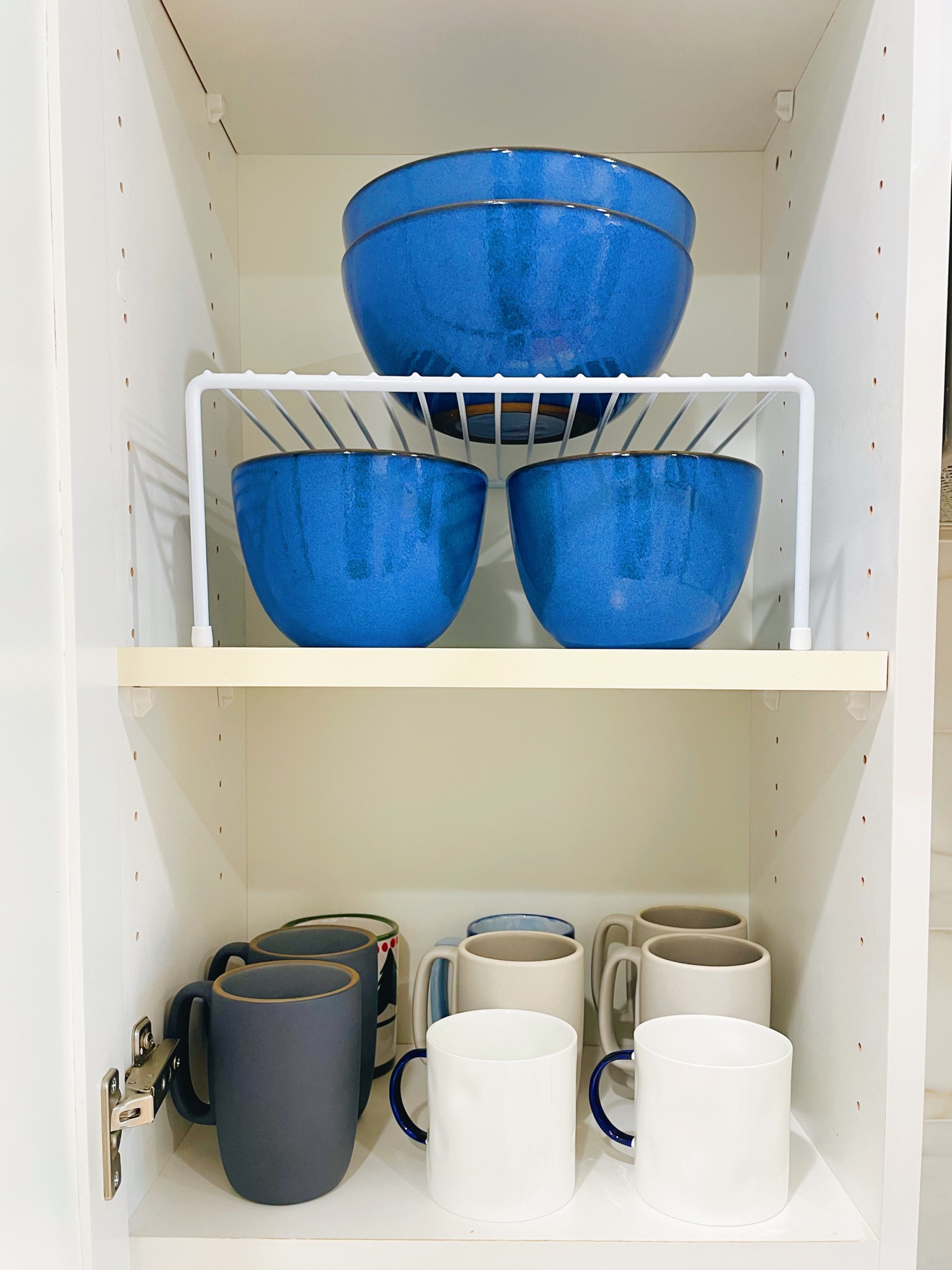 Every kitchen dish cabinet needs these amazing risers! They maximize the vertical space to allow for more things to fit on a shelf! 

#LTKhome #LTKfindsunder50 #LTKMostLoved