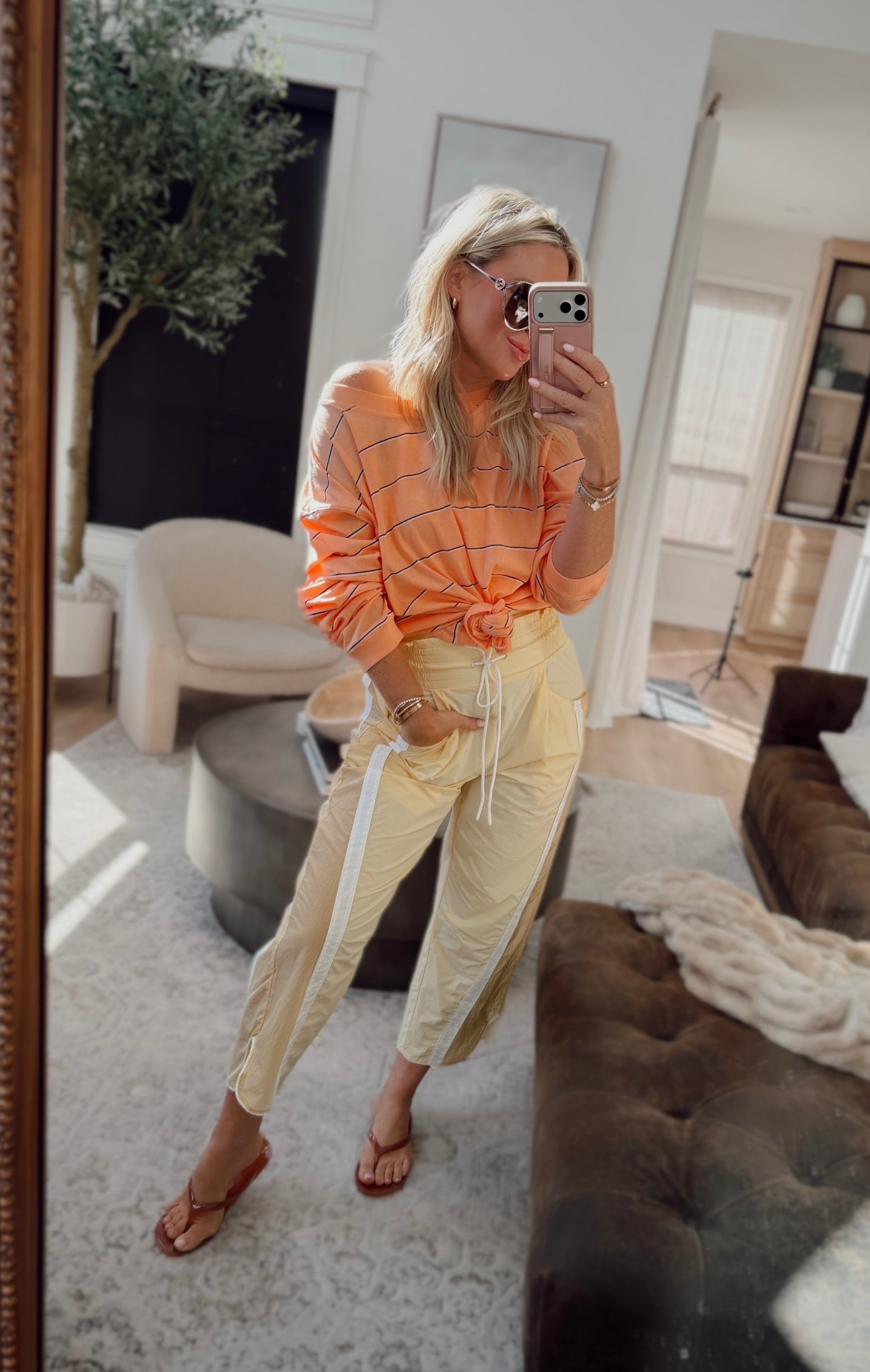 These yellow pants are such a fun spring piece ☀️ they’re water resistant and have the cutest track pant detail with the white side stripes. They also come in five other colors. I’m wearing a small.

Paired them with this top (also comes in other colors) and I love the orange + yellow combo for spring — such a fun pop of color 🙌

@fpmovement #fpmovementpartner

spring outfits, vacation outfits, active wear, spring outfits 2026, track pants  

#LTKmomlife #LTKActive #LTKootd