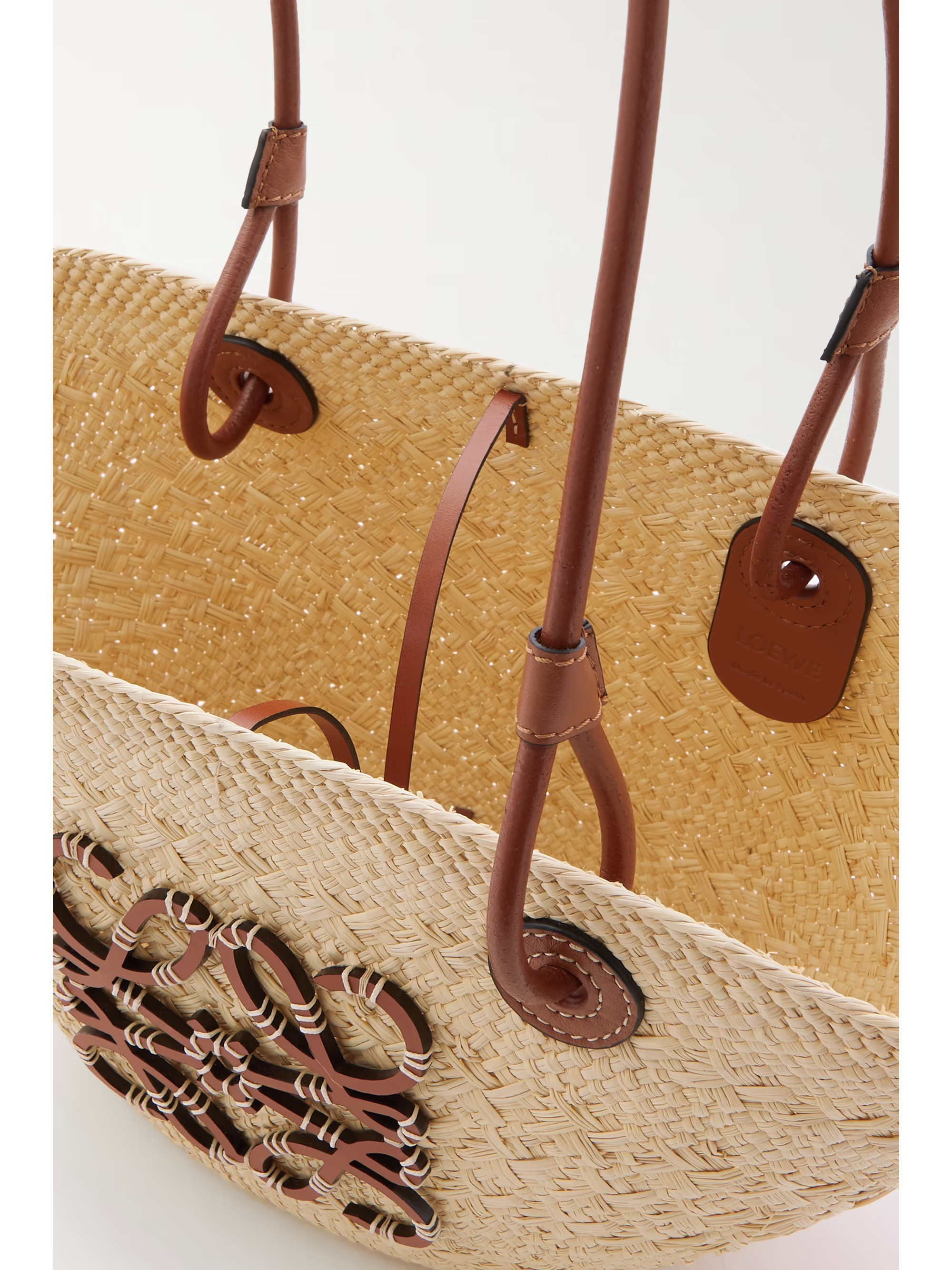+ Paula's Ibiza Anagram small leather-trimmed woven raffia tote | NET-A-PORTER (UK & EU)