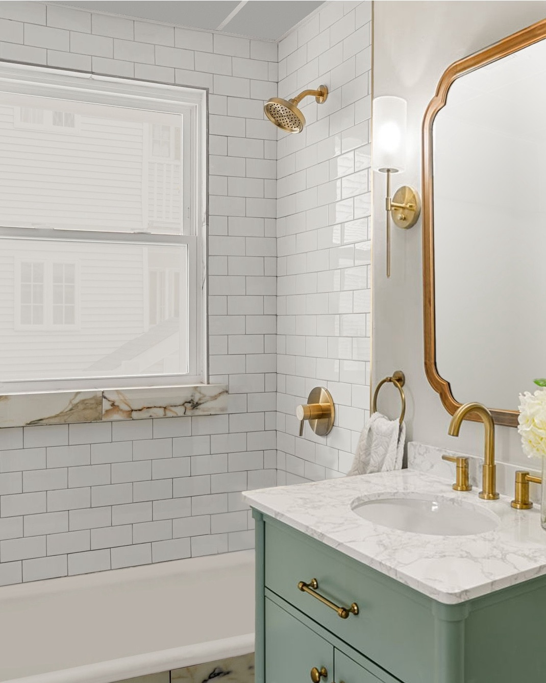 #AD we're excited to share the finished renovation of the first of two bathroom designs #dwelloctoberstudio is creating as a design challenge featuring brand new @Lowe's products. when designing this bathroom, our goal was to create an elegant space reminiscent of a spa. to accomplish this, we started by selecting a beautiful sea green vanity as the focal point of the design. we paired the vanity with a curved wood mirror and brushed gold transitional wall sconces. the gold is carried throughout the rest of the room, including the plumbing fixtures and accessories, as well as the floor tile, which is a large format porcelain tile with gray and gold veining. we completed the look with simple white subway tile on the walls, a jute rug with a metallic pattern, and a white hydrangea faux flower arrangement to add warmth and sophistication to the room. #LowesPartner #dwelloctober

#LTKHome