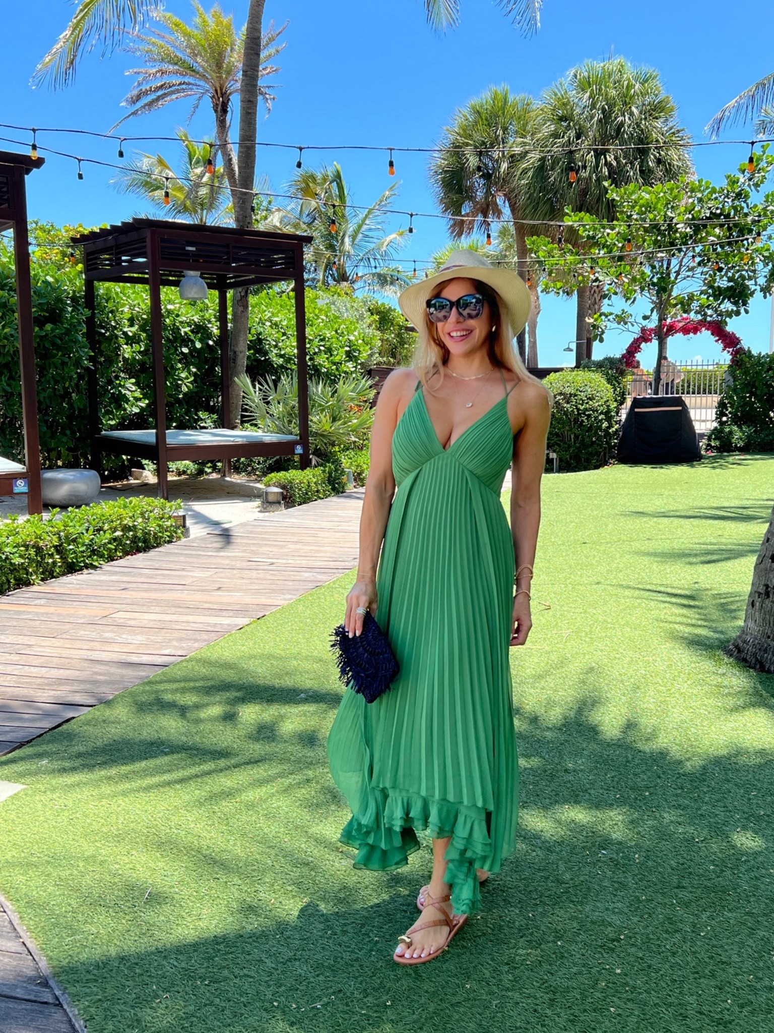 Green, pleated, and absolutely resort-ready — this look has vacation written all over it. Paired with a straw hat, tan sandals, and a navy woven clutch for that perfect tropical afternoon vibe. 🌴☀️

Some days you just dress for the moment — and the moment is everything. ✨

Drop your fave destination emoji below 👇

#ResortWear #VacationOutfit #GreenDress #SummerStyle #OOTDInspo #TropicalVibes #MidiDress #VacationMode #SummerFashion #ResortStyle #HatStyle #BeachLook #StyleInspo #SummerDress #TravelStyle

#LTKdayinmylife #LTKootd #LTKTravel