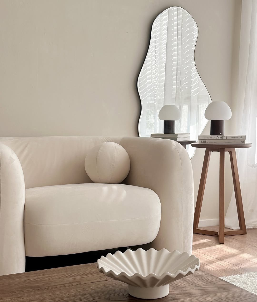 Creamy neutrals and cozy corners ☁️ Creating a serene and inviting space is all about the details. I'm loving the soft textures and minimalist vibes in this living room. The organic shaped mirror adds a touch of whimsy, while the mushroom lamps bring a warm glow. This is my happy place for relaxing and unwinding. ✨
#NeutralDecor #LivingRoomGoals #CozyVibes #HomeDecor #LTKHome #InteriorDesign #MinimalistDecor #OrganicDesign #MushroomLamps #HomeStyling #SereneSpace #InteriorLovers #CreamyNeutrals

#LTKHome #LTKSeasonal #LTKActive