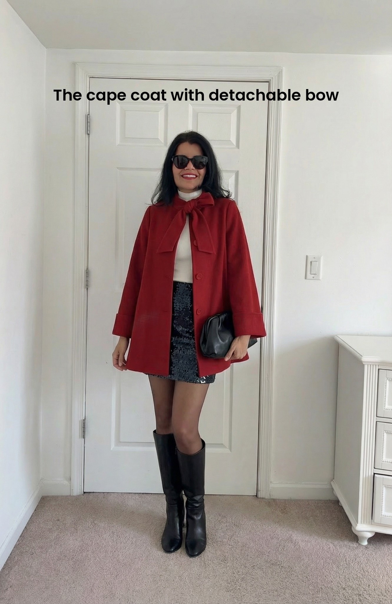 Be the head turner at the holiday party with this gorgeous cape coat with a cute, detachable bow! 