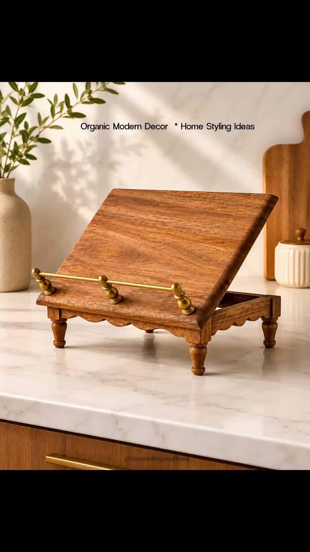 Neutral organic modern kitchen decor finds I’m loving lately 🤎 This viral wood cookbook stand is finally back in stock for pre-order and it’s such a beautiful piece for styling kitchen countertops, coffee bars, and open shelving. I paired it with warm wood accents, a scallop basket, ceramic crock, and neutral organic modern decor pieces that give that elevated cozy kitchen look. Perfect if you love Magnolia style kitchens, neutral home styling ideas, organic modern kitchen accessories, and timeless countertop decor that feels warm and collected. Save for later & follow me on LTK for daily home decor finds, neutral styling inspiration, kitchen decor ideas, and organic modern home favorites.

#LTKHome #LTKSaleAlert