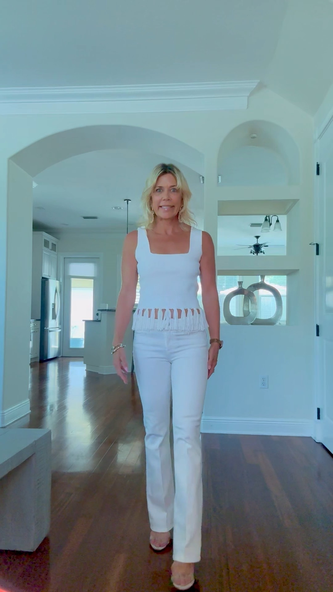 All white fun outfit to wear this spring. These petite white boot cut jeans fit amazing and are true to size. Love the fringe on the white top. These petite white top runs a little large so if in between sizes, size down. 

#LTKStyleTip #LTKOver40 #LTKSeasonal