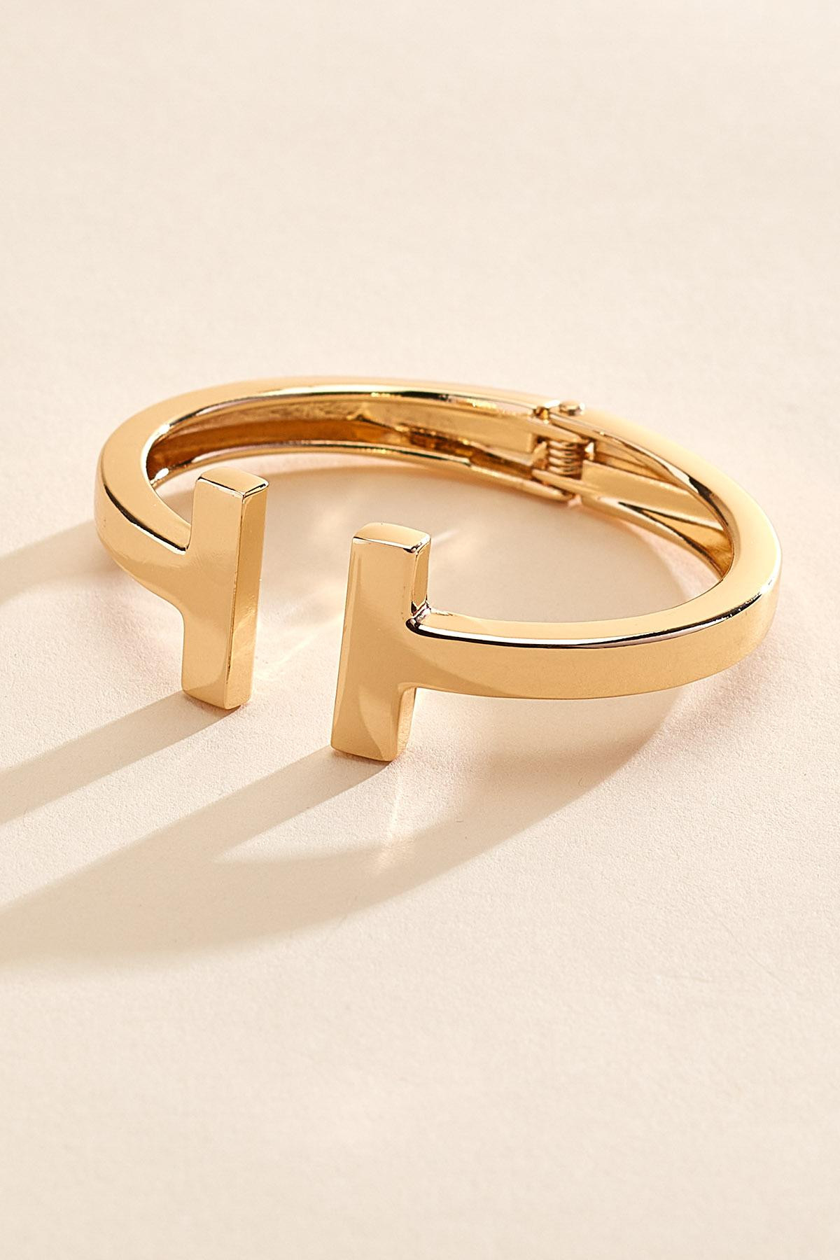 gold logo cuff bracelet | Versona