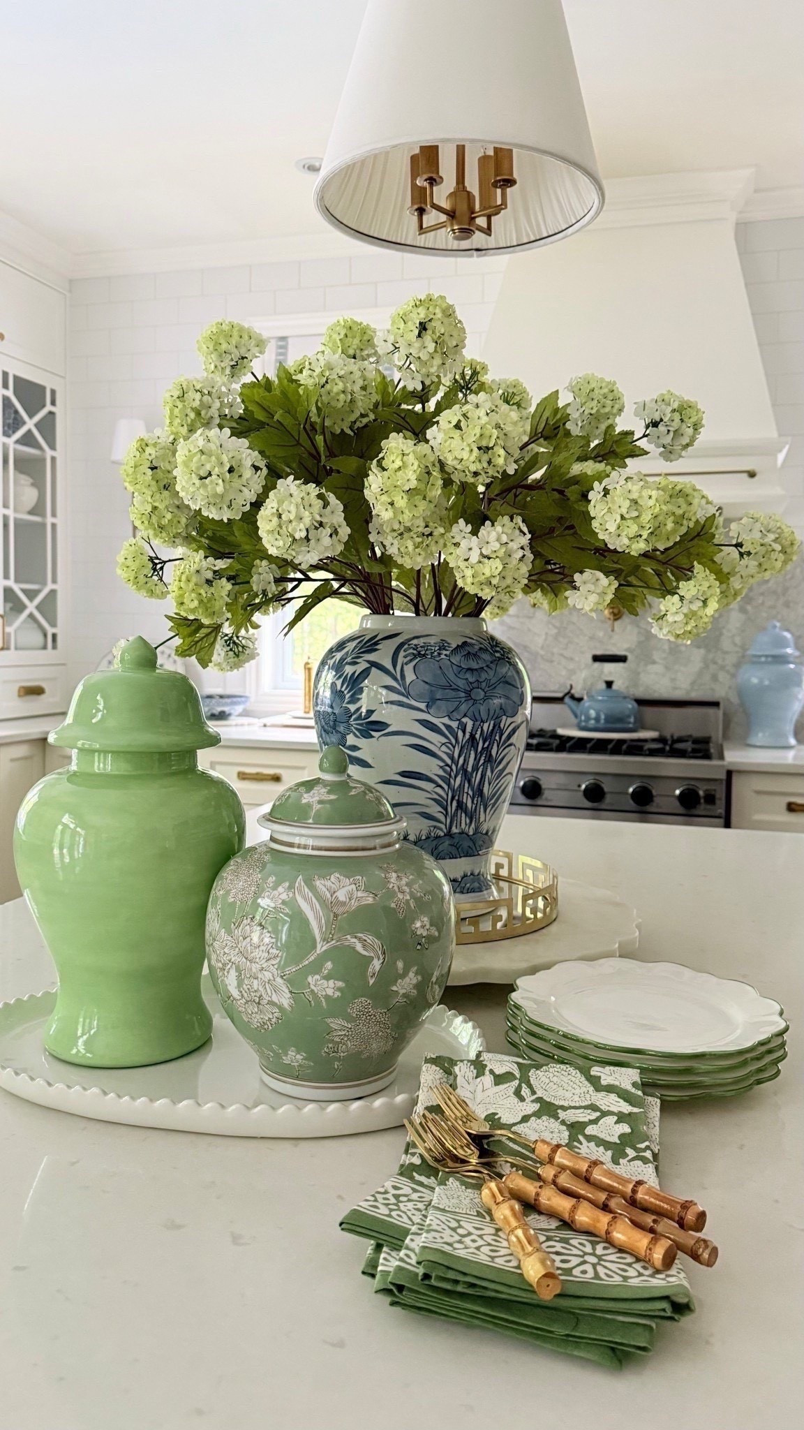 Chic summer kitchen ! Home decor in gorgeous blue and green. Chinoiserie, ginger jars, bamboo flatware, hydrangeas, snowball hydrangeas

#LTKHome #LTKSeasonal