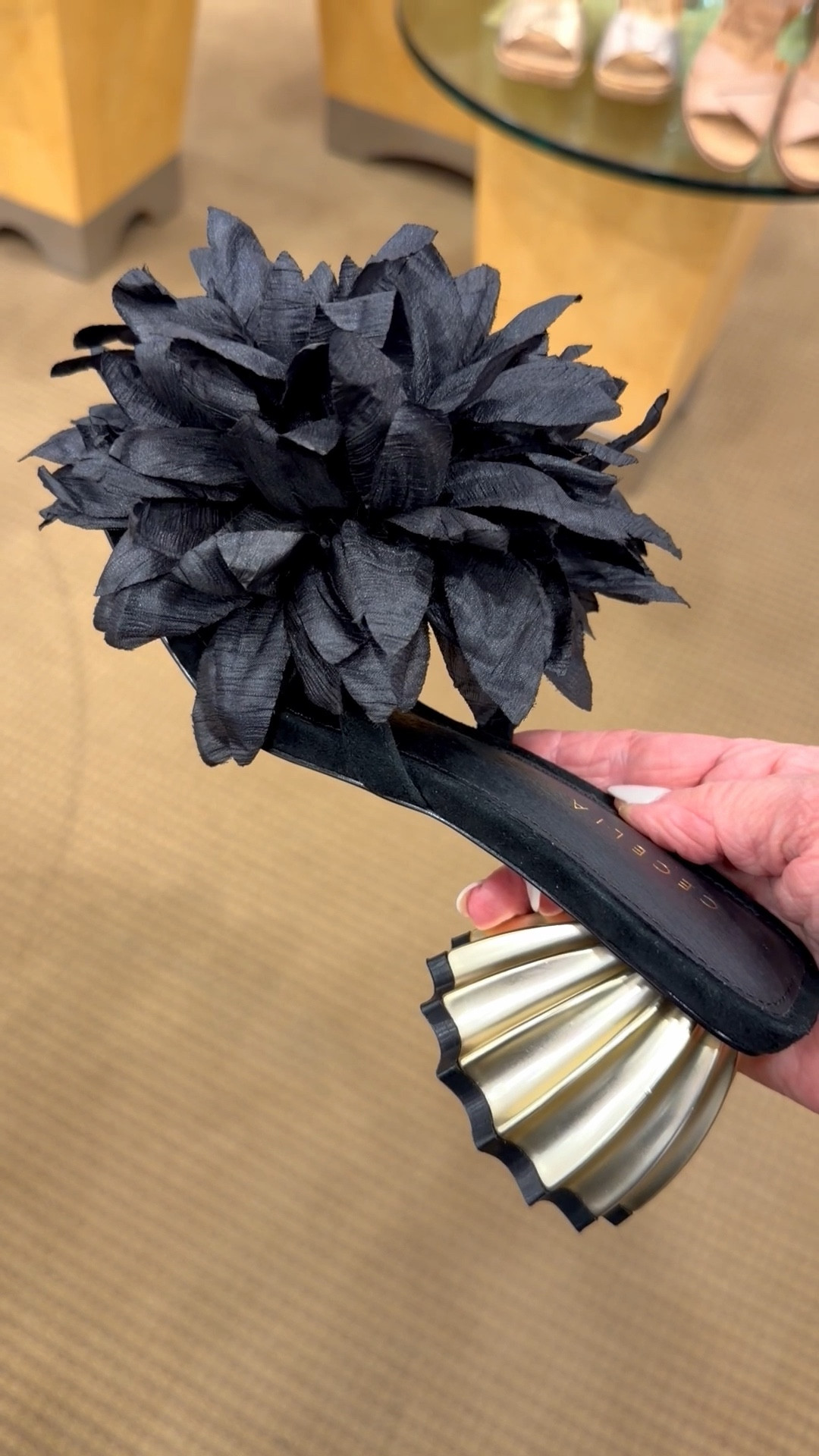 So dang cute A botanical appliqué emboldens the vamp of a captivating sandal framed by a modern square toe and sculptural heel. Slide, sandal 
Color: Black
2.5" heel (size 8.5)