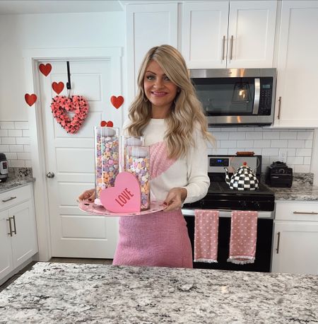 Valentines outfit and centerpiece idea! Vday home decor links from Amazon. Glass cylinder vases, candy hearts, and unscented candles. Pink skirt and amazon heart sweater! 💖

#LTKhome #LTKunder100 #LTKunder50