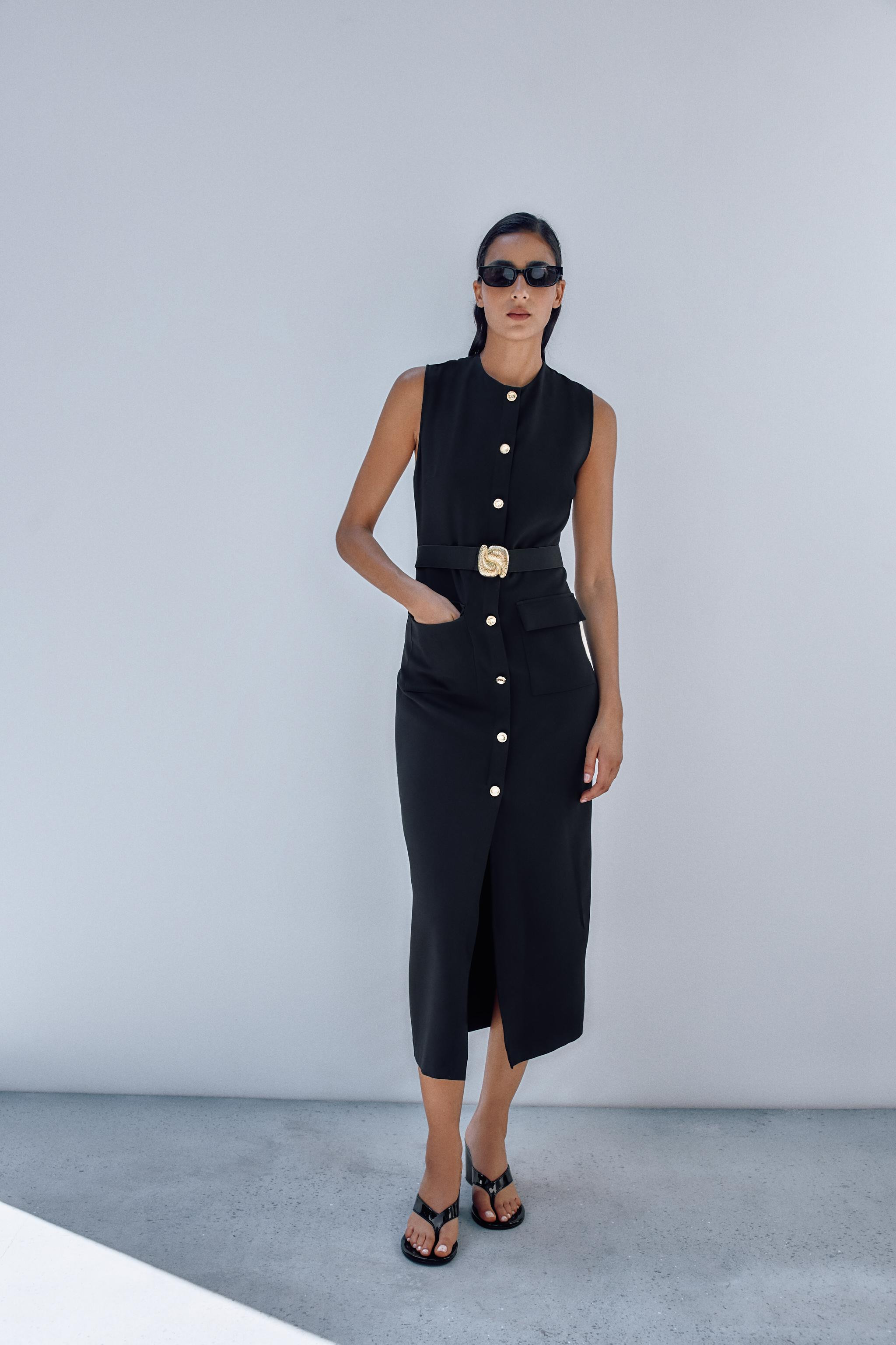 Sleeveless, round neck dress. Featuring mock buttons, an elasticated waistband with a gold appliq... | Zara US