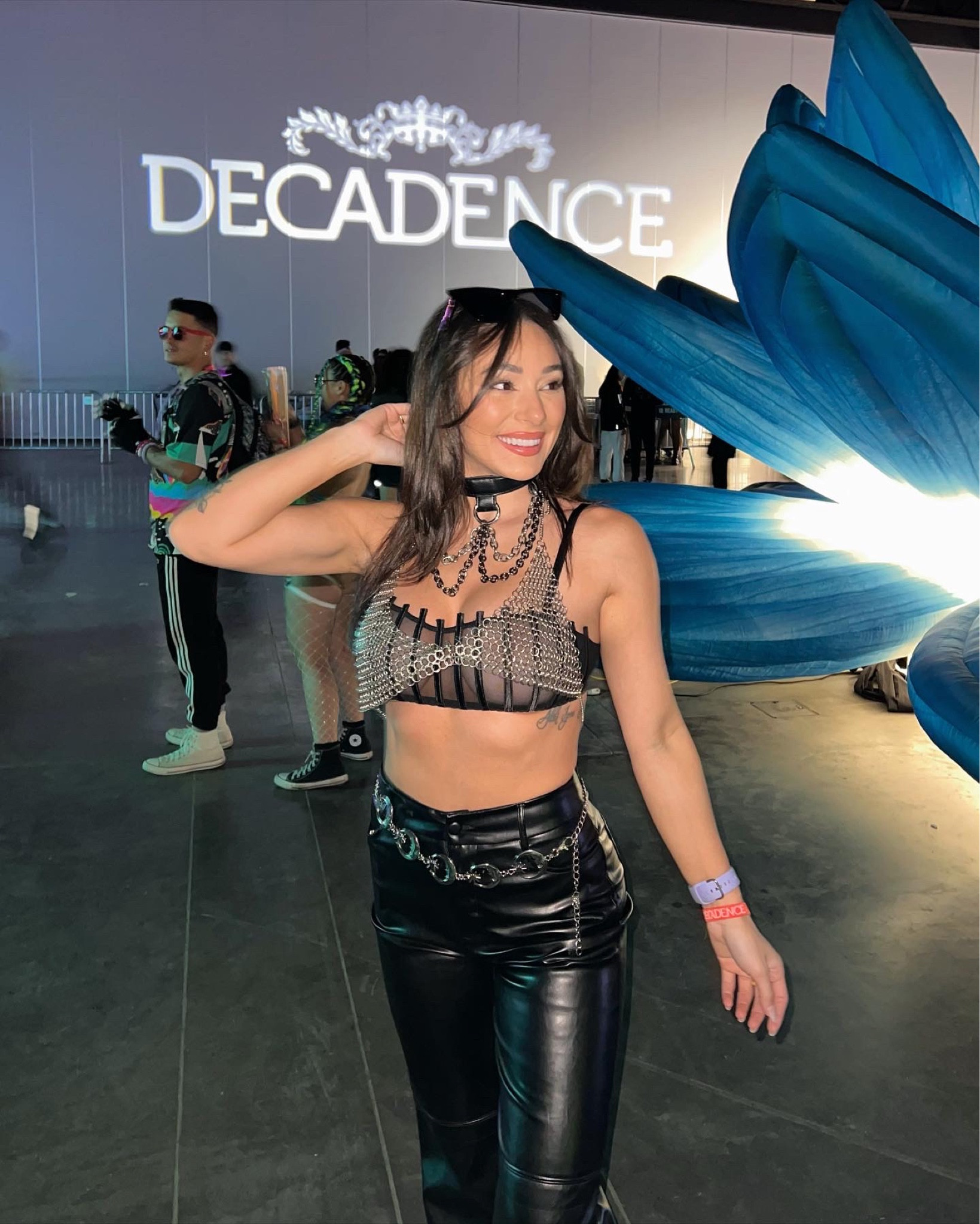 Music festival concert outfit ideas inspo chain bra bralette silver grunge Emo pink look leather blank pants wide leg moon chain belt rave 

#LTKFestival #LTKstyletip #LTKunder100